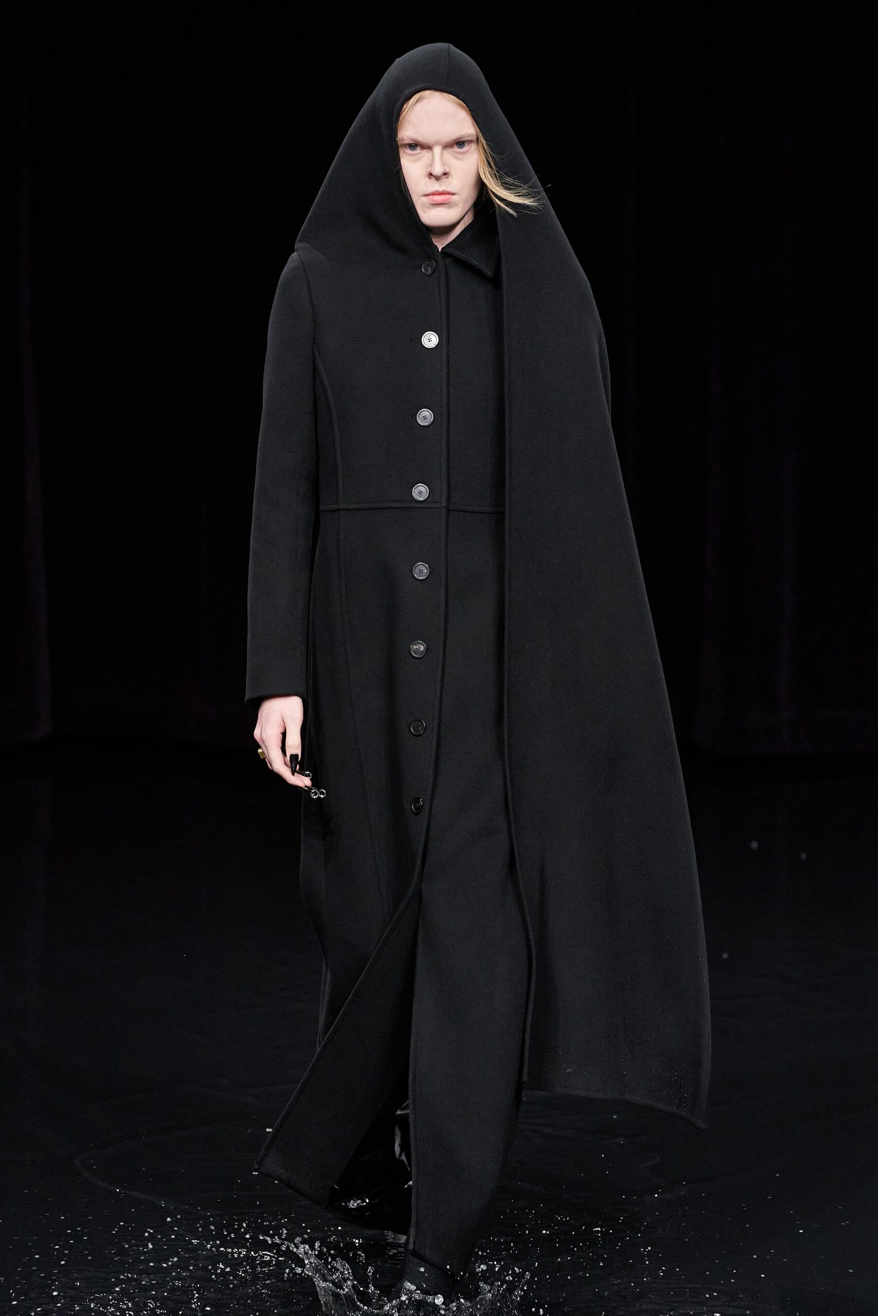 black wool long-sleeve collared fitted buttoned draped coat