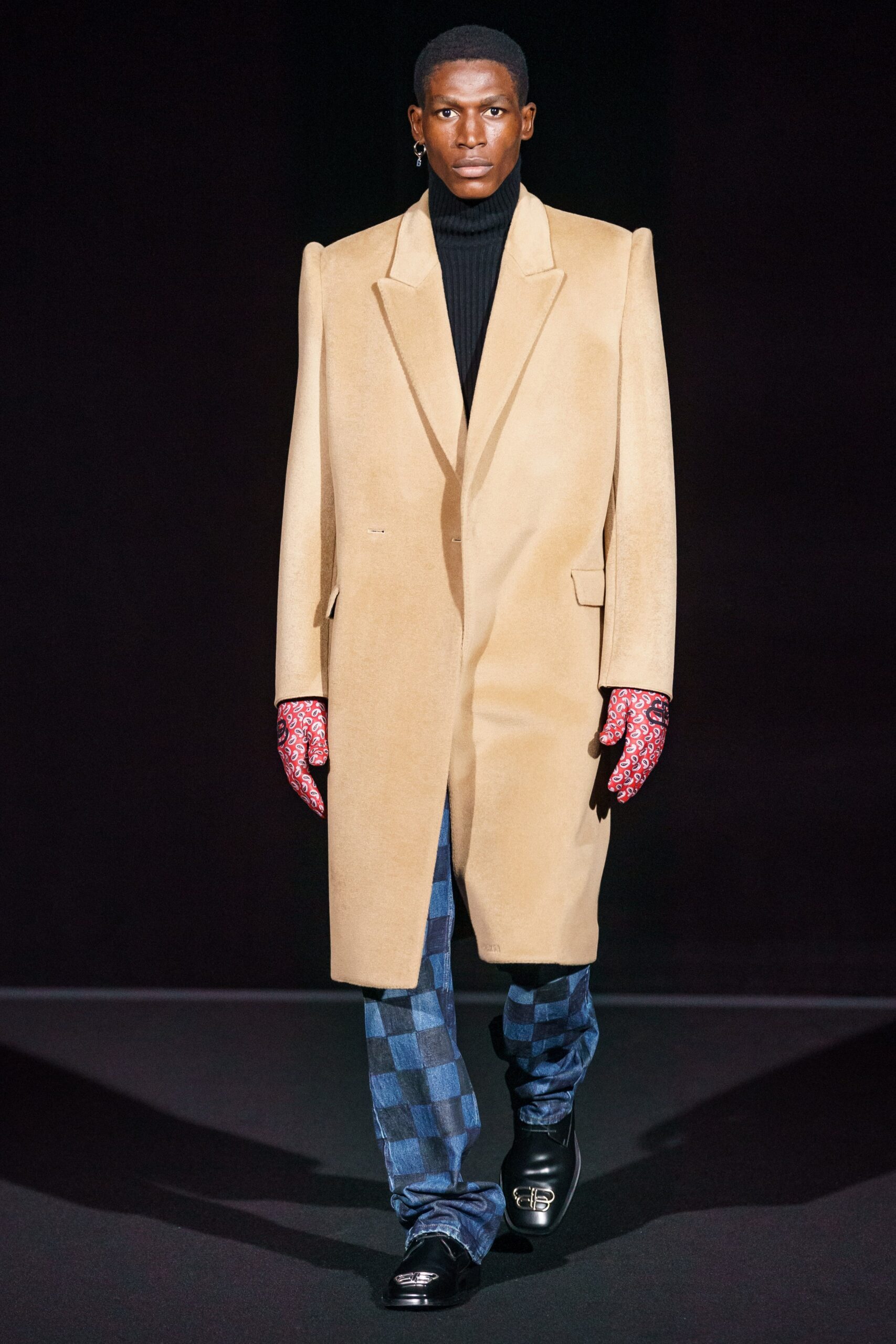 beige wool coat with black turtleneck