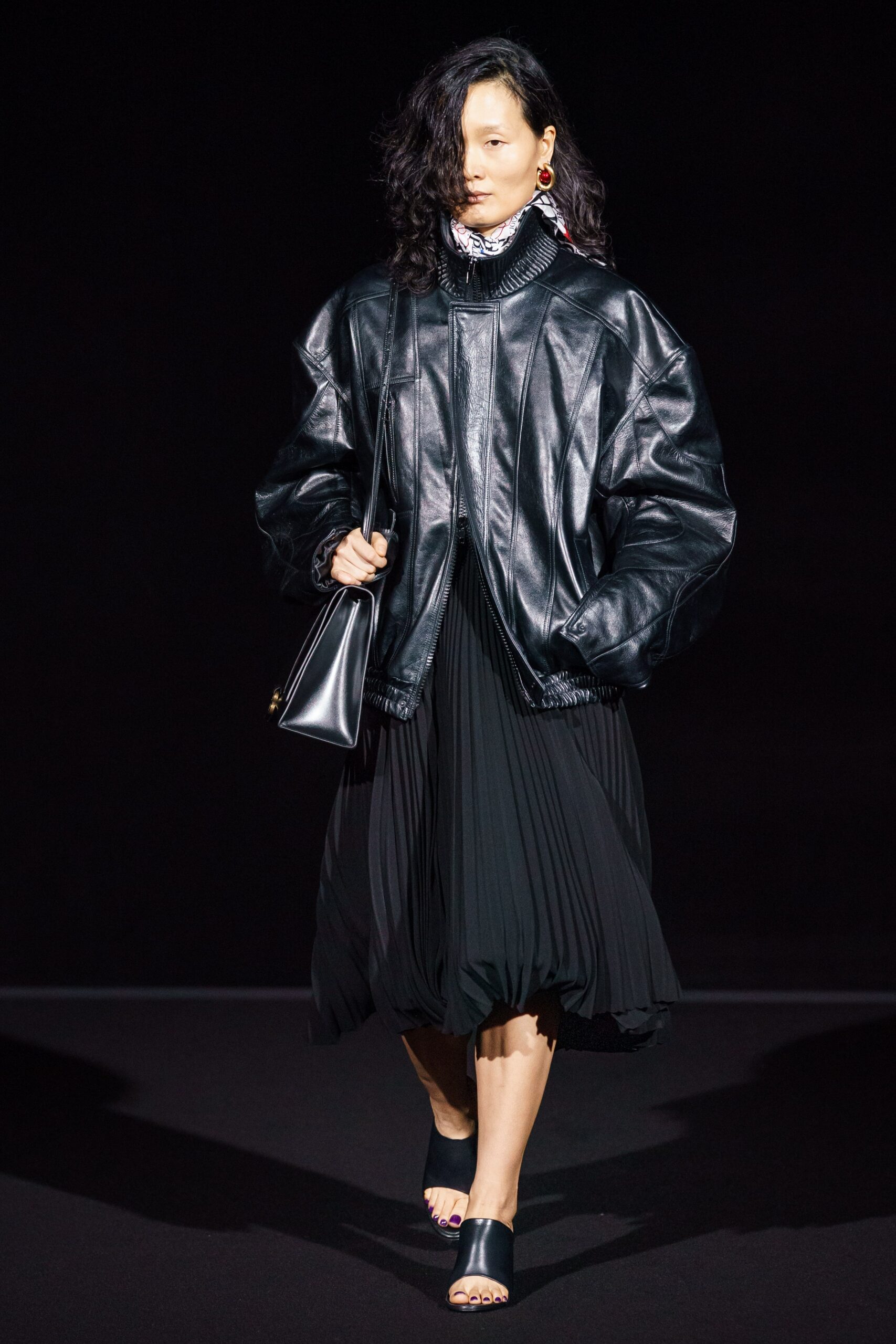 black leather oversized jacket and pleated dress