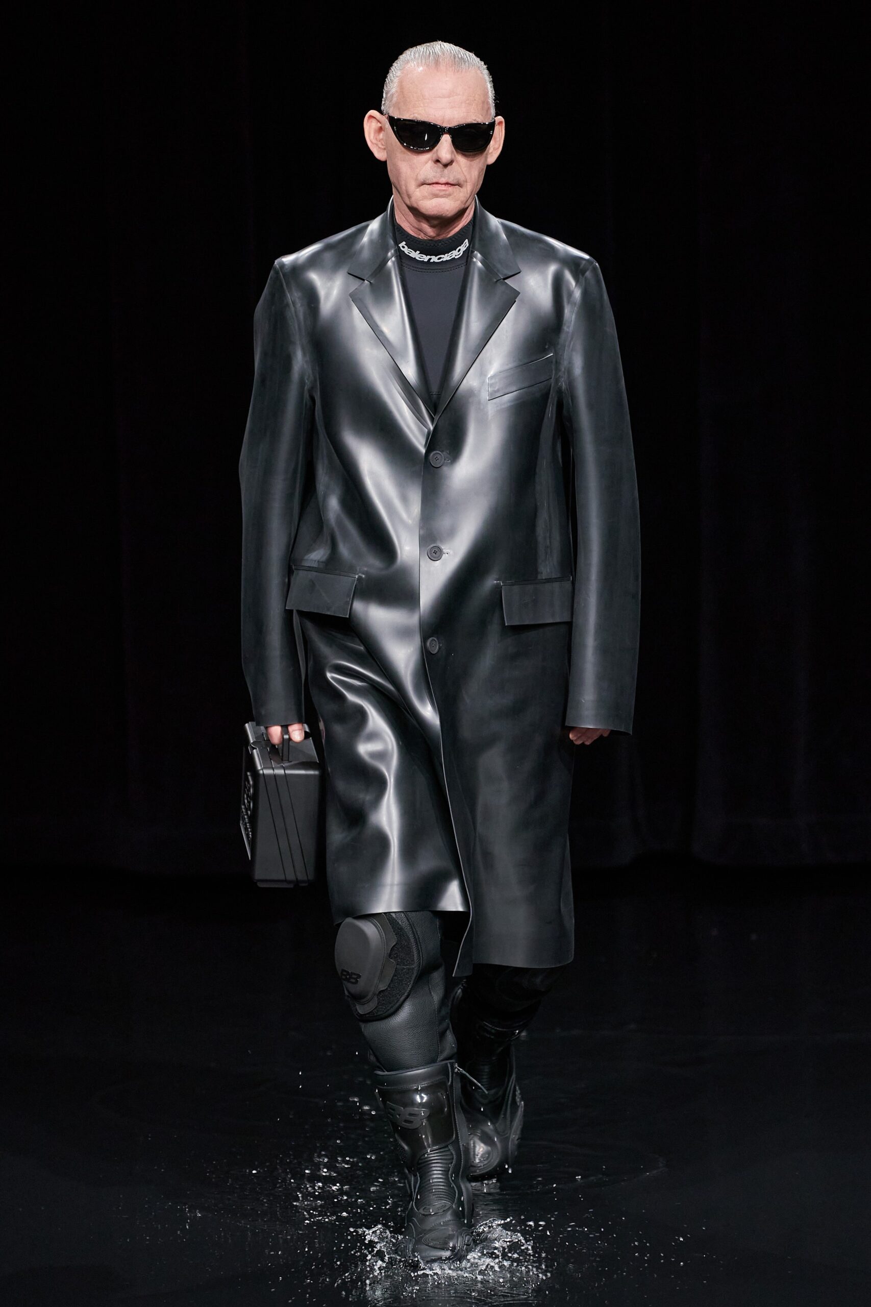 black vinyl long-sleeve collared relaxed buttoned shiny coat
