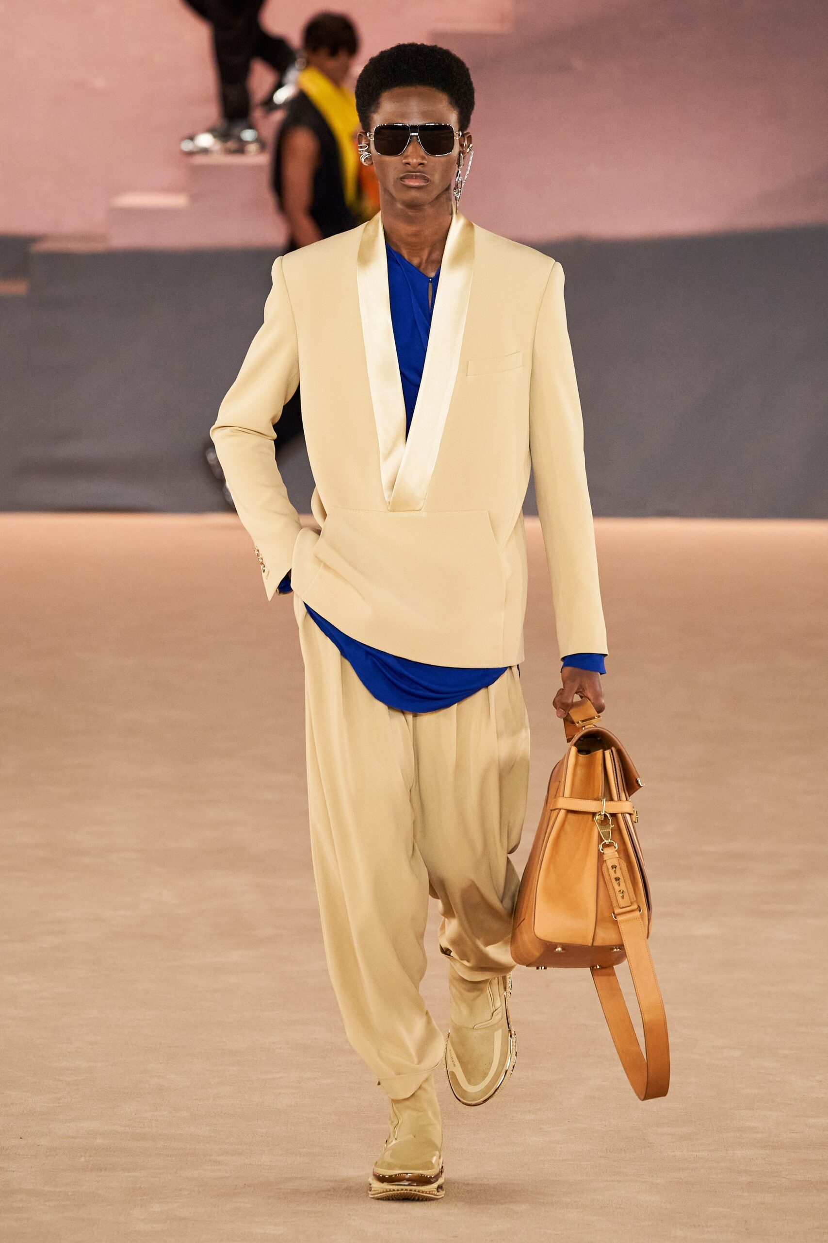 beige tailored suit with blue top