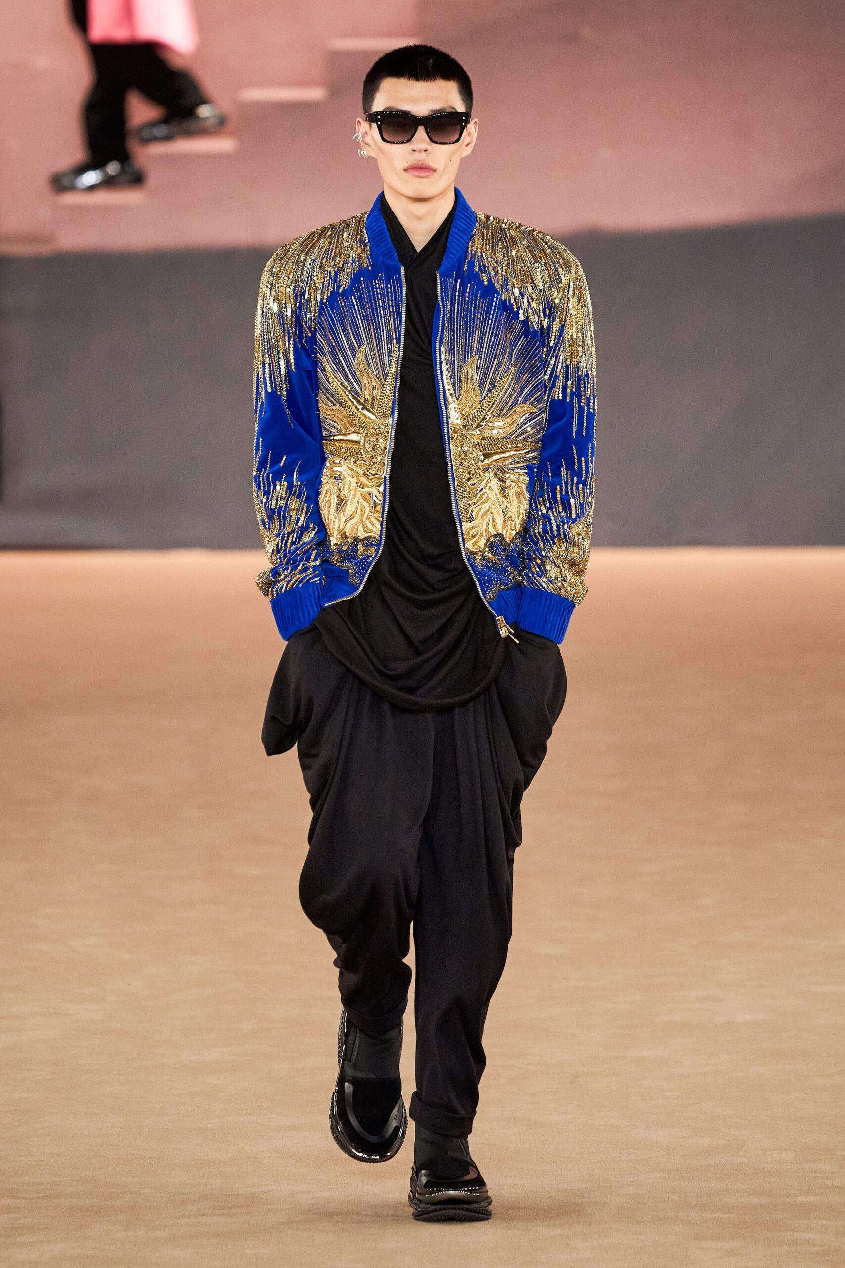 blue embroidered jacket with black top
