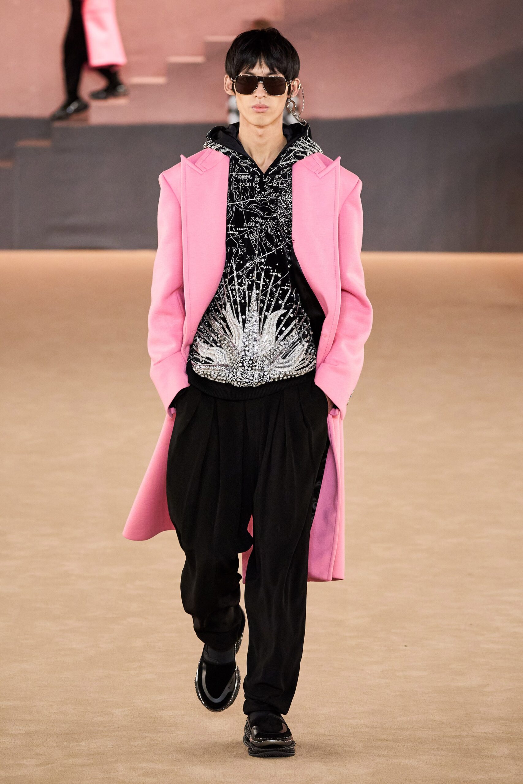 pink wool coat with black hoodie