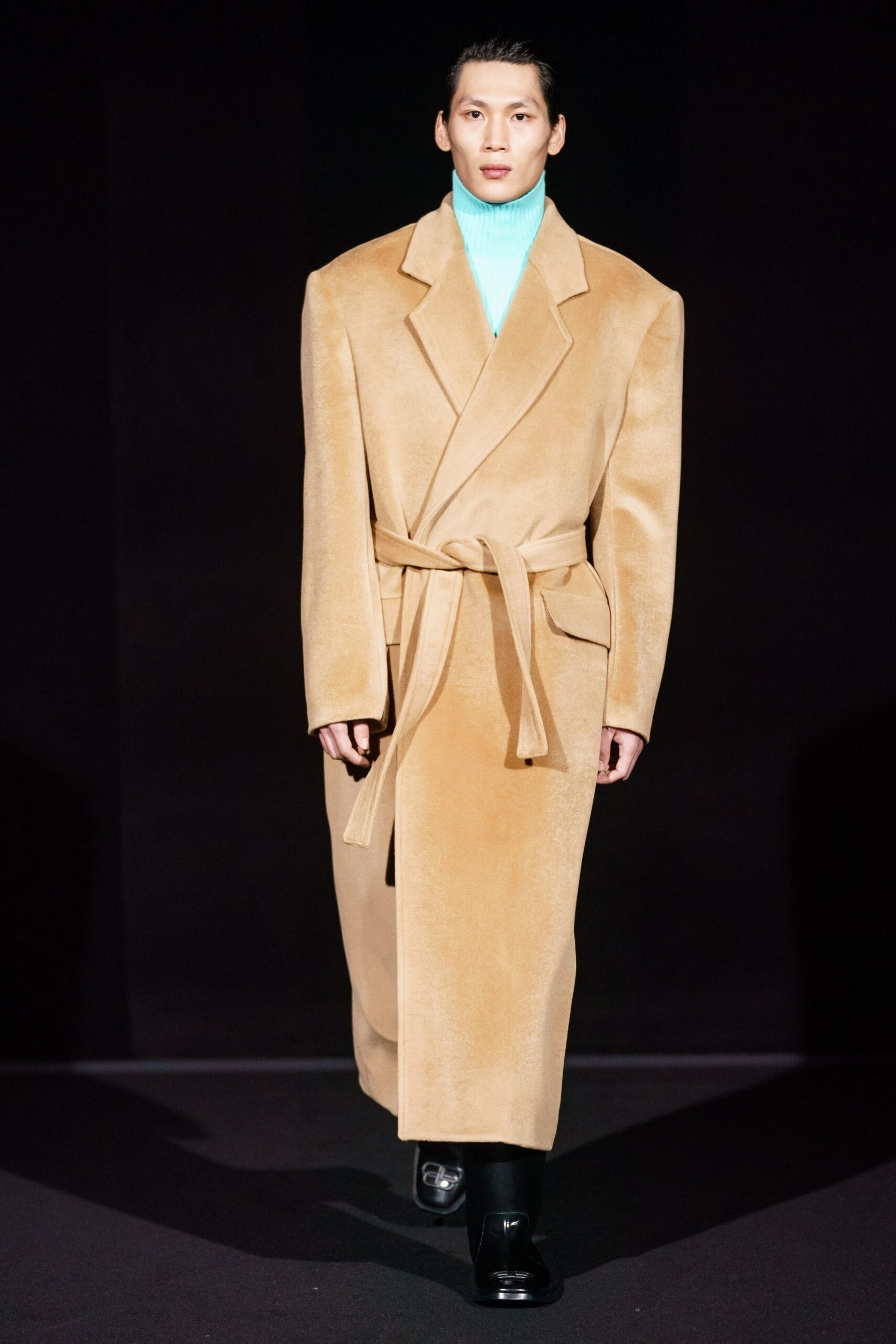 beige oversized coat with blue turtleneck