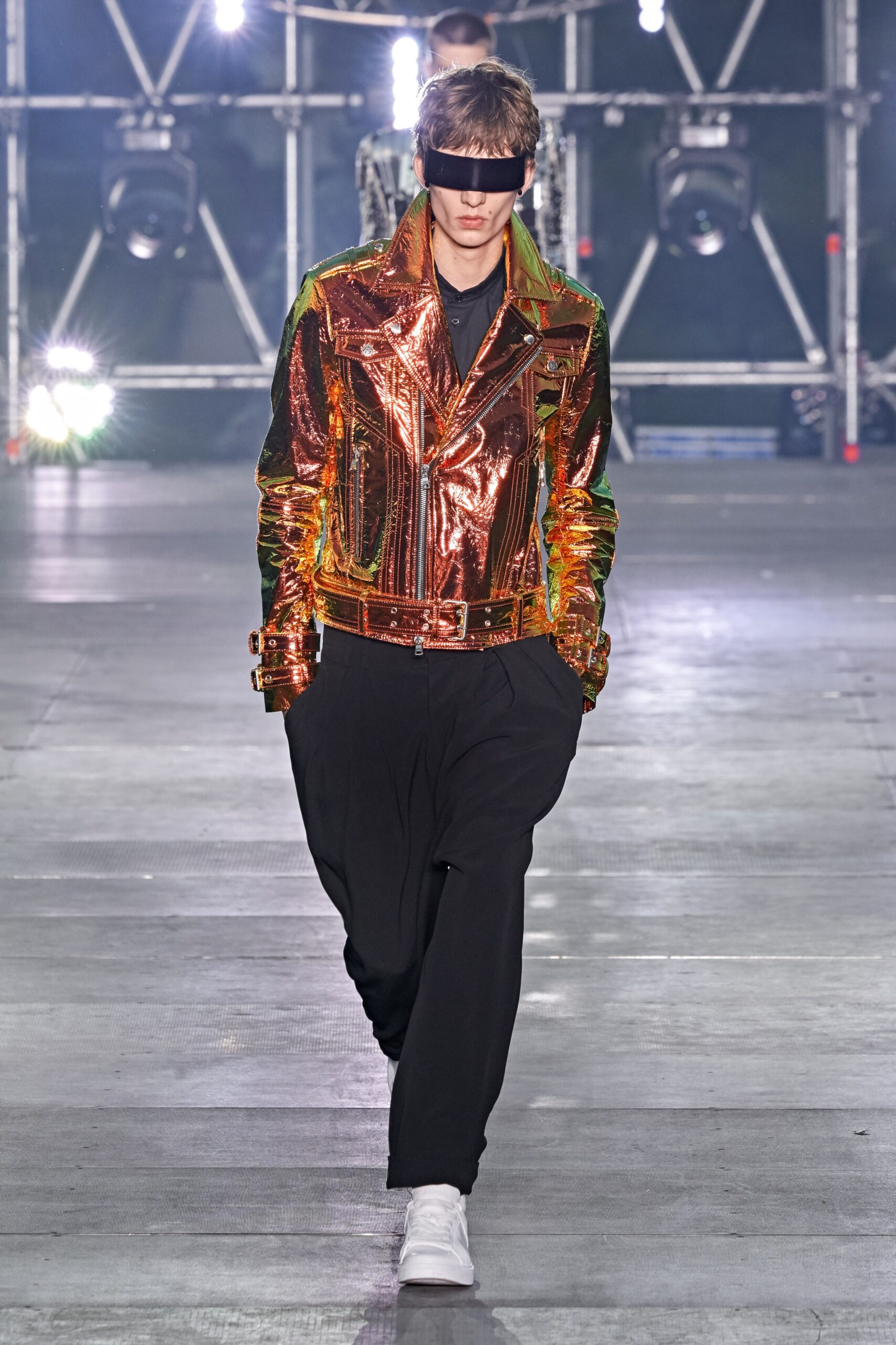 shiny orange vinyl jacket with relaxed black pants