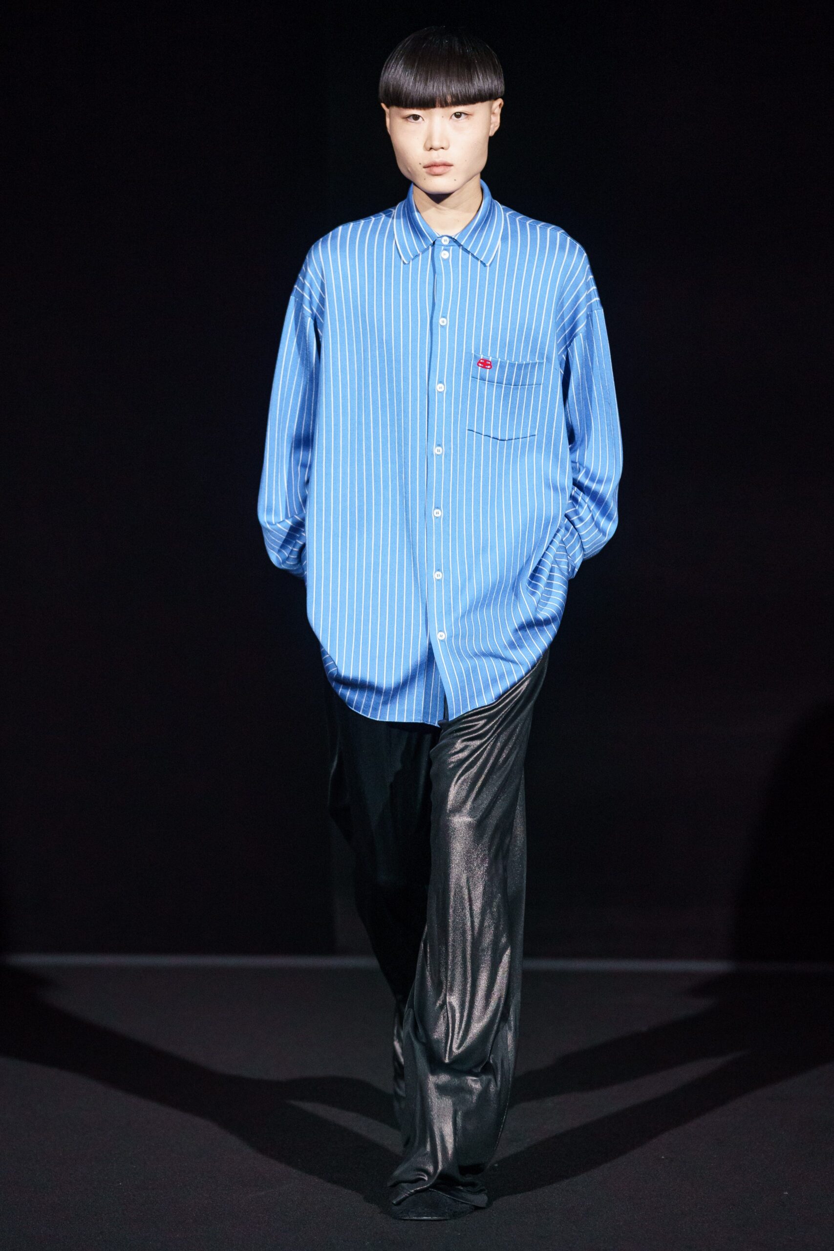 blue striped shirt and black leather pants