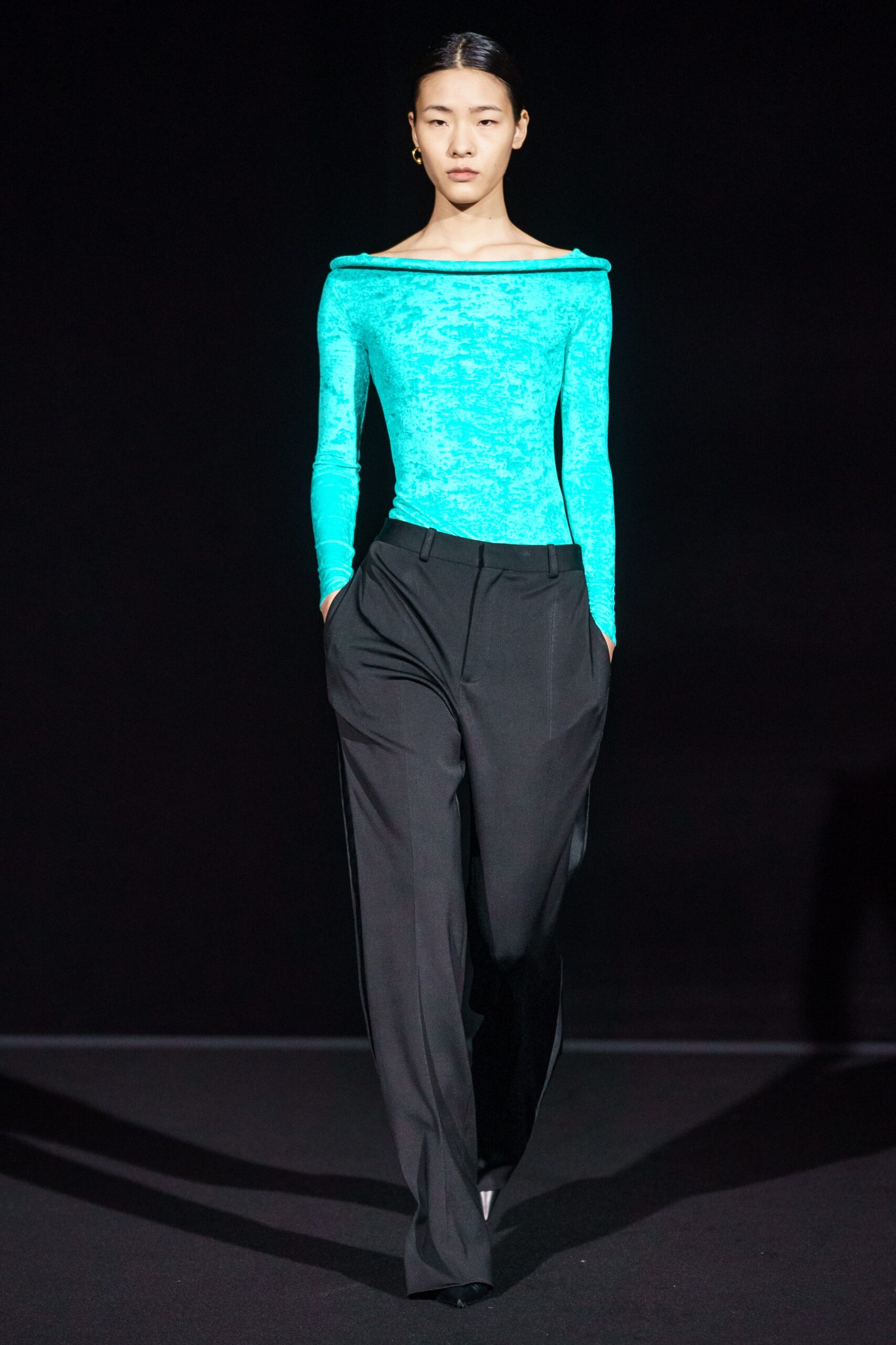 blue fitted off-shoulder top with black pants