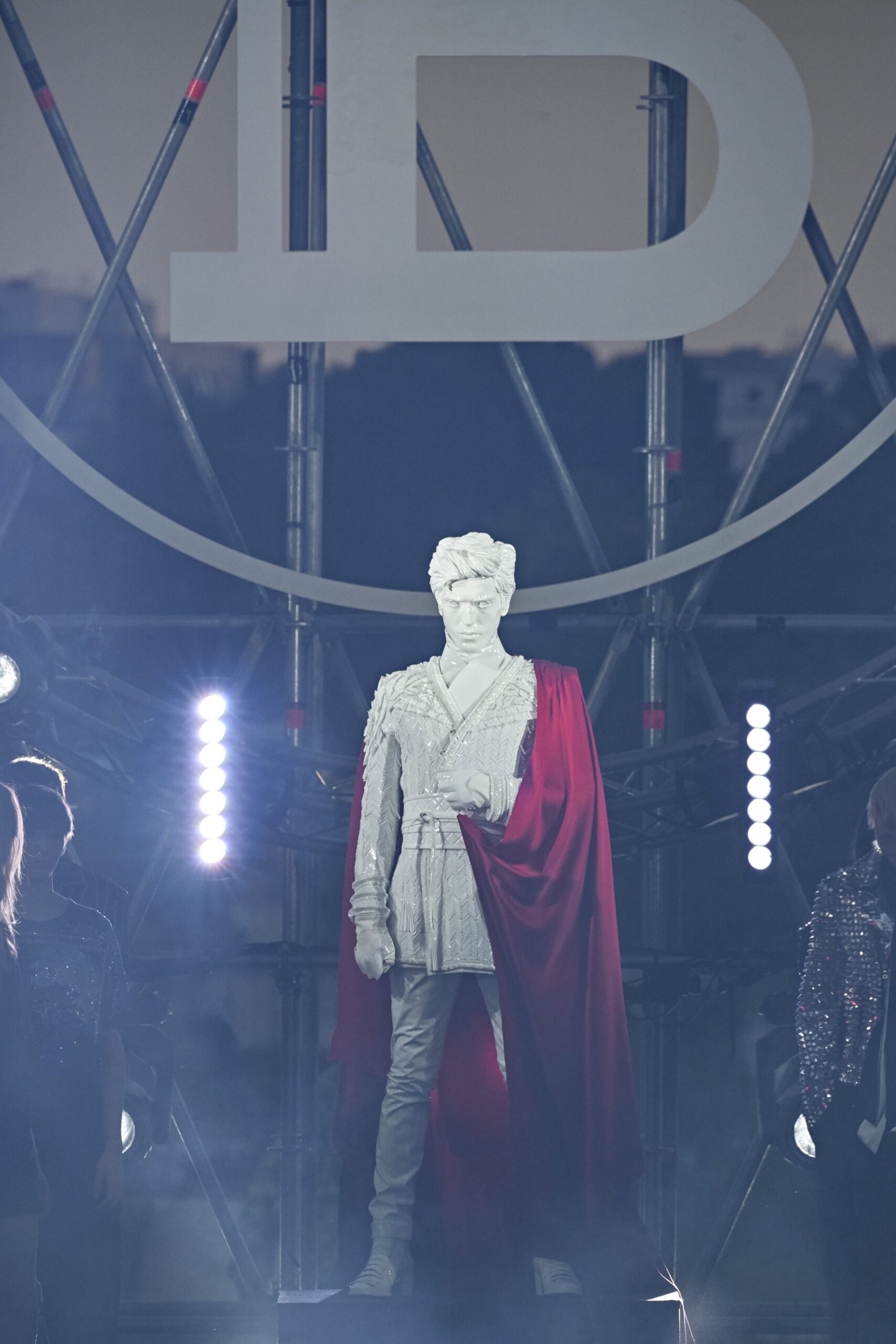 red silk cape and white suit