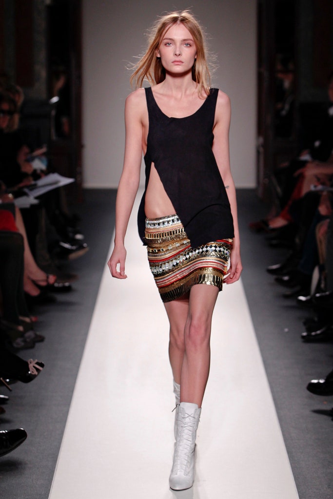 black fitted top with fringed skirt