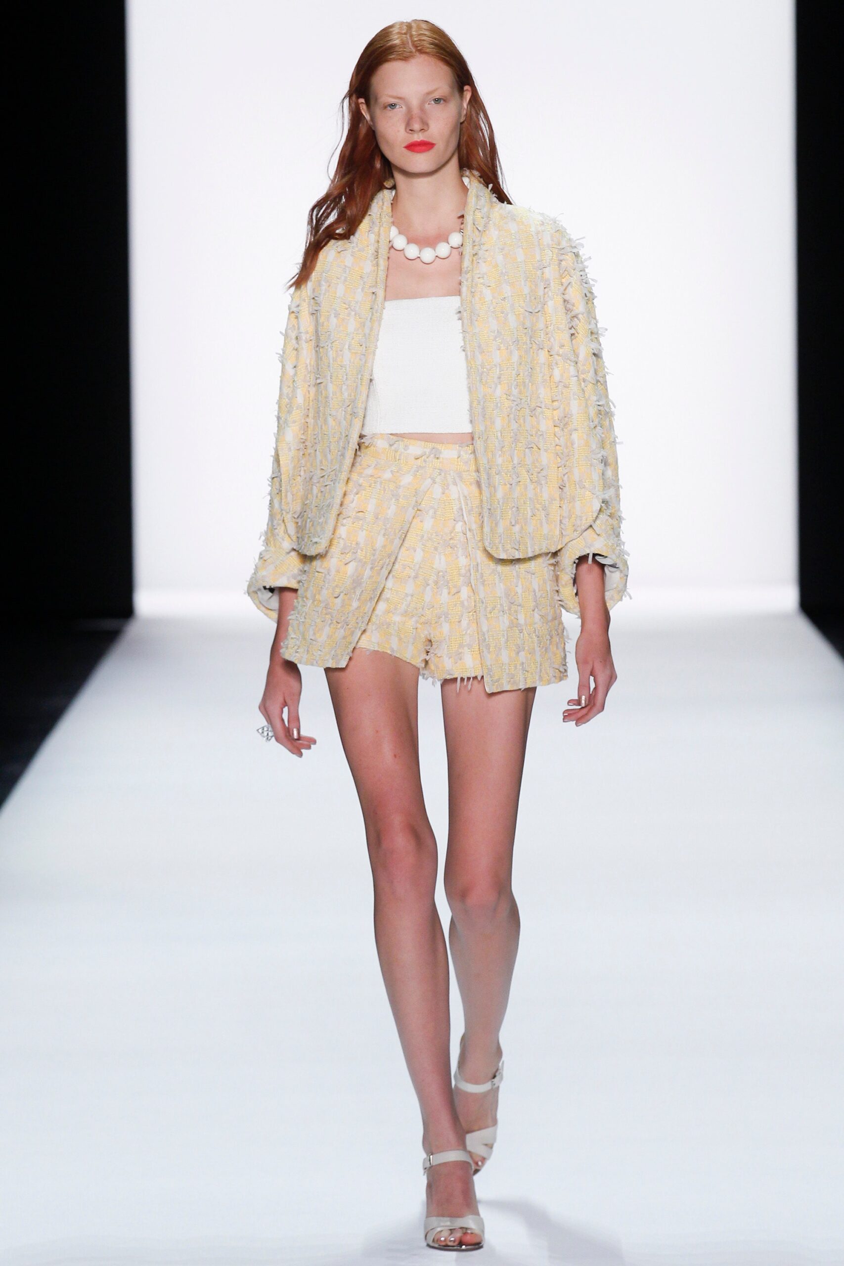 yellow fringed jacket and mini skirt