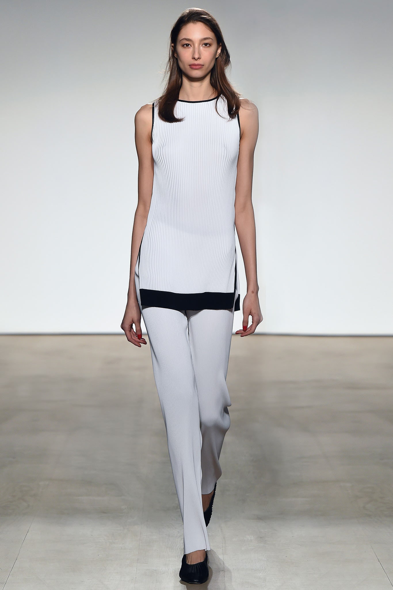 fitted white top and gray pants