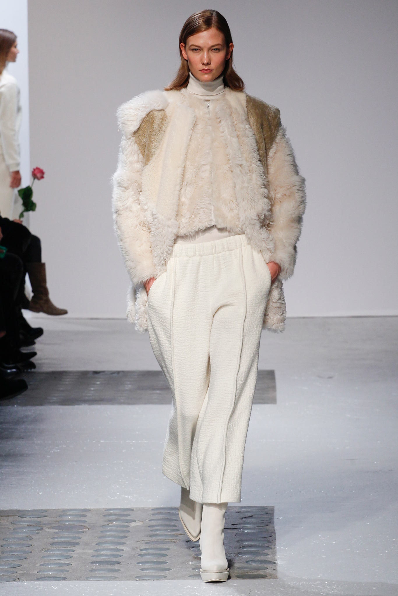 white faux-fur coat with relaxed pants