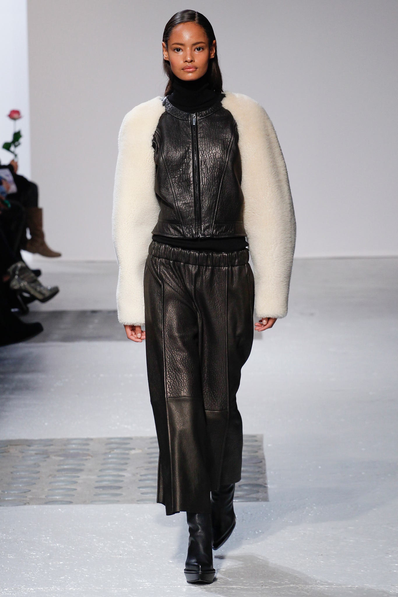 black leather long-sleeve collared fitted zippered jacket