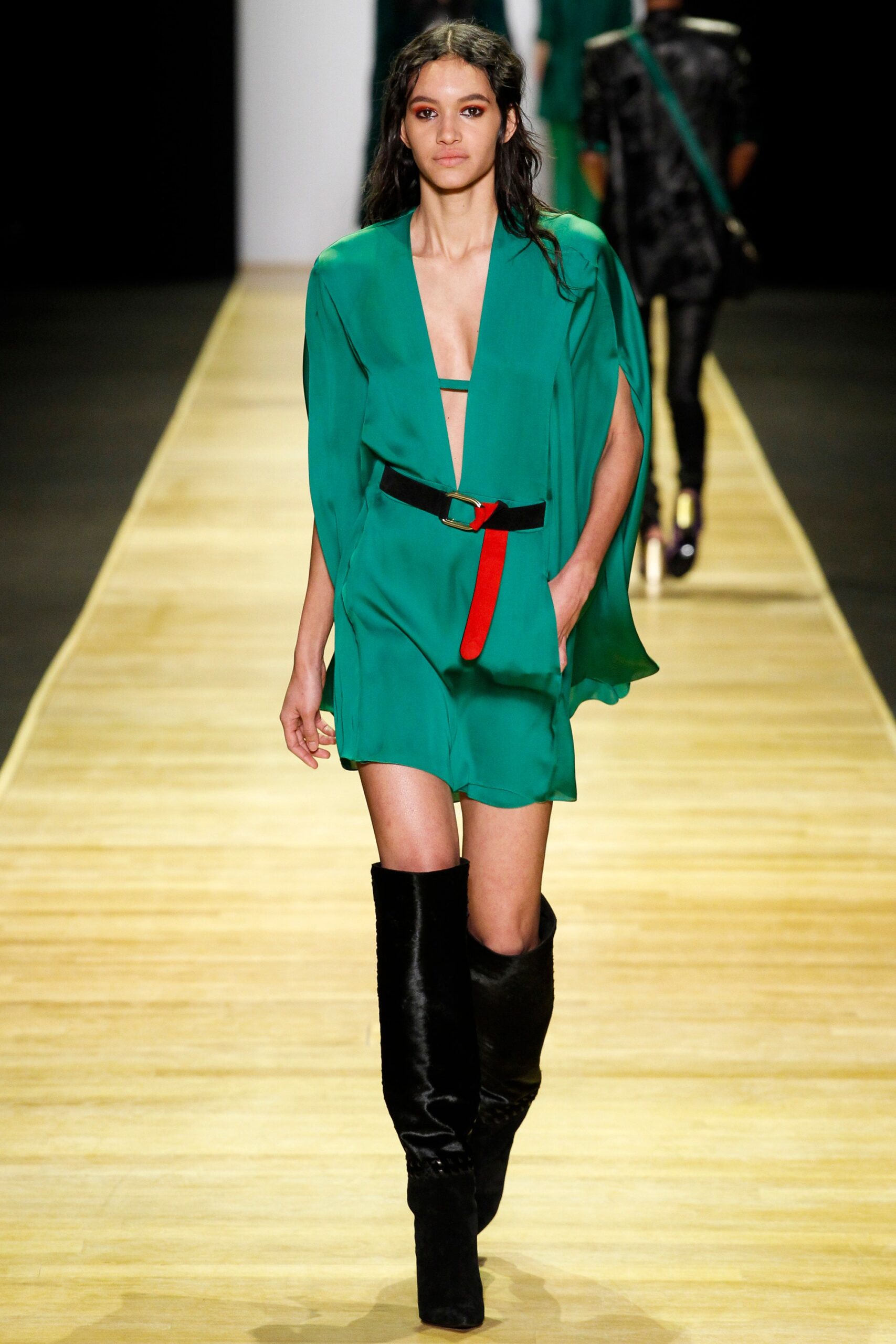green mini dress with black boots