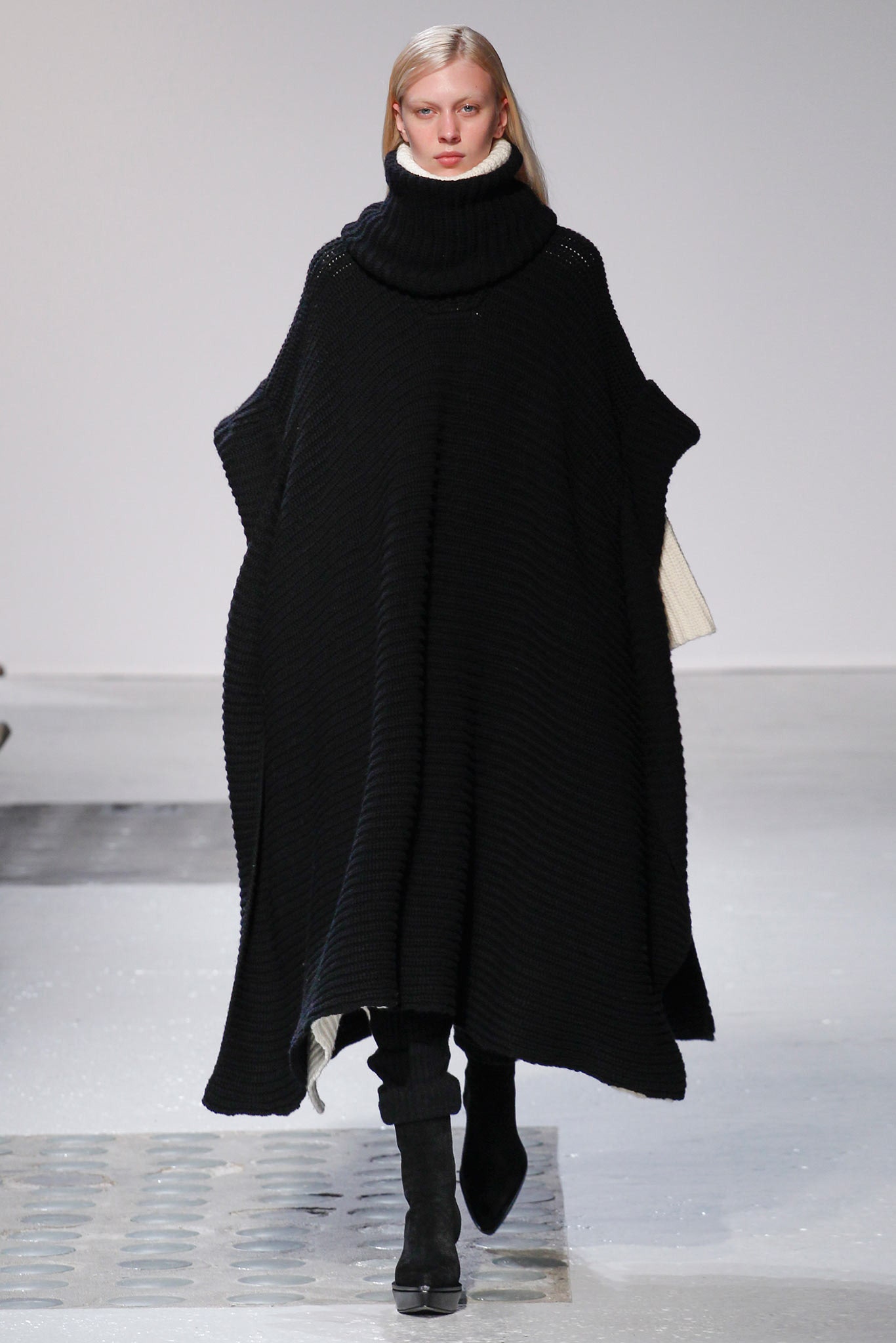 black wool sleeveless high-neck relaxed ribbed poncho