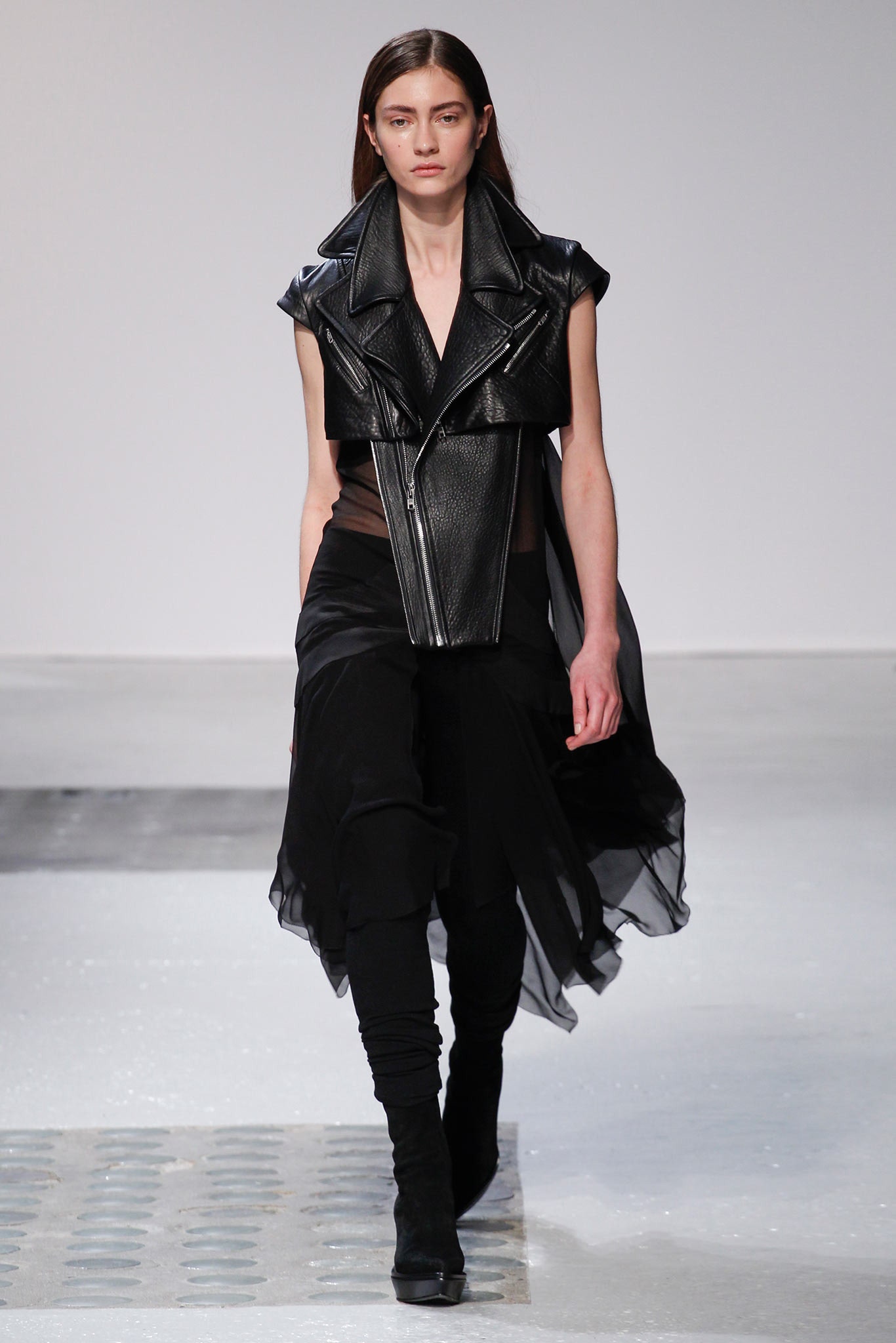 black leather sleeveless jacket with flowing skirt