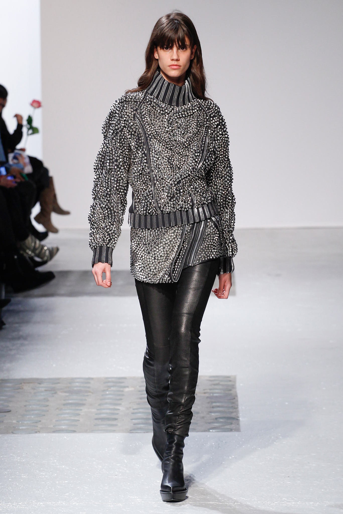 black and white embellished sweater with leather pants