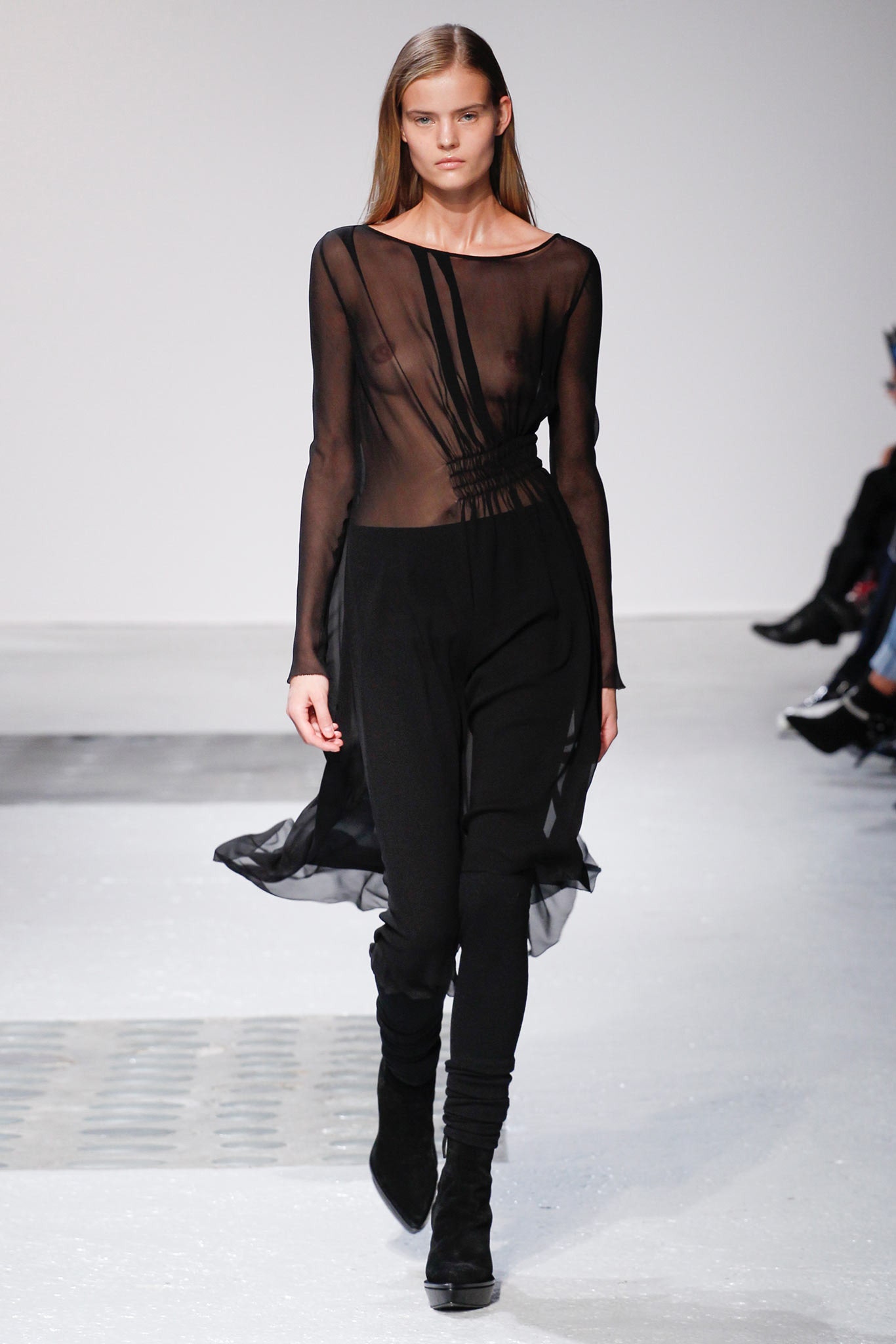 black sheer long-sleeve top and fitted pants