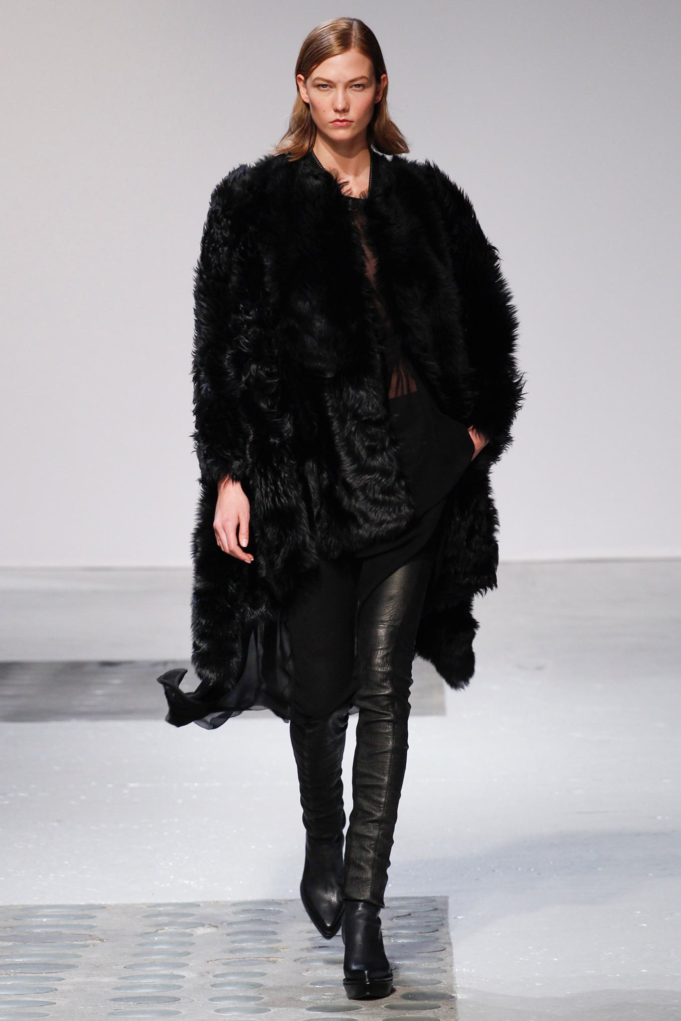 black faux-fur coat with leather pants