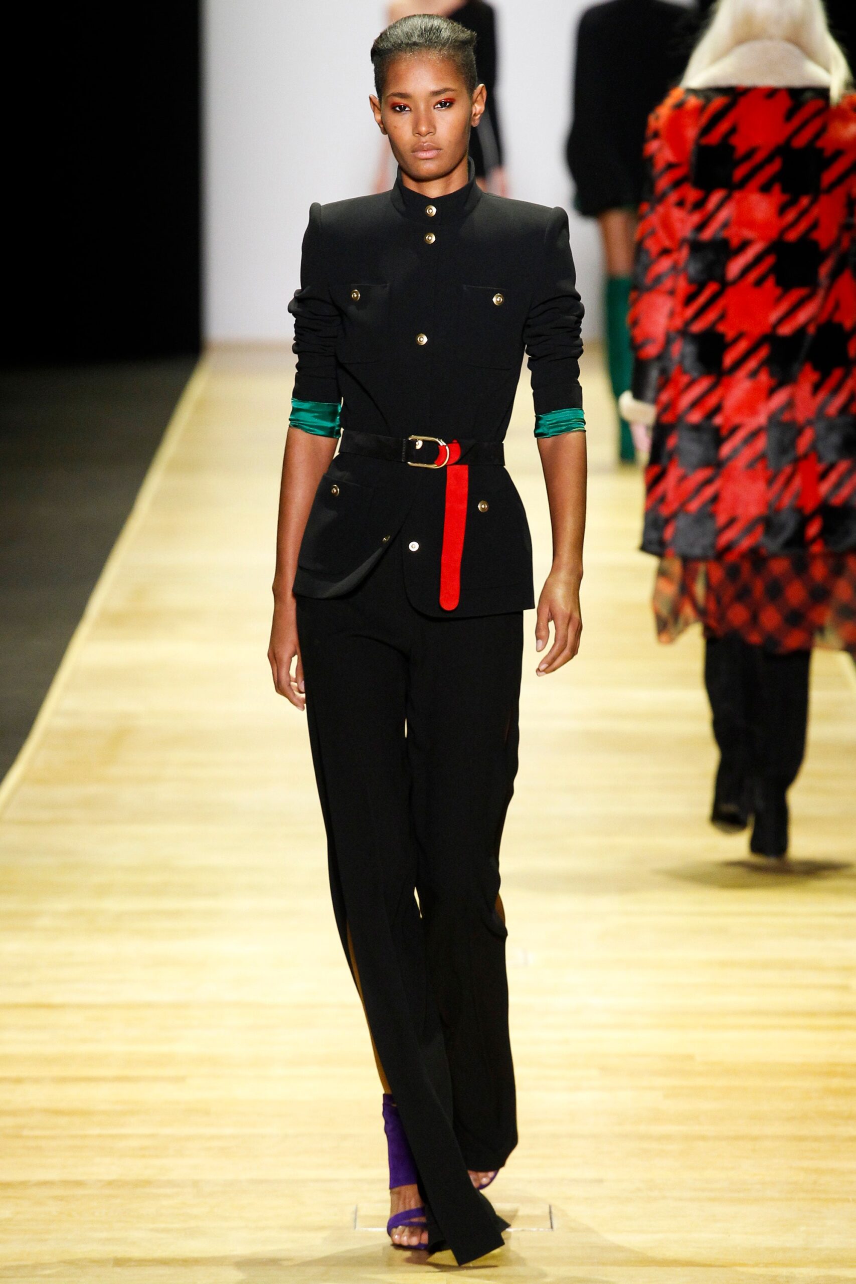 black tailored suit with red belt