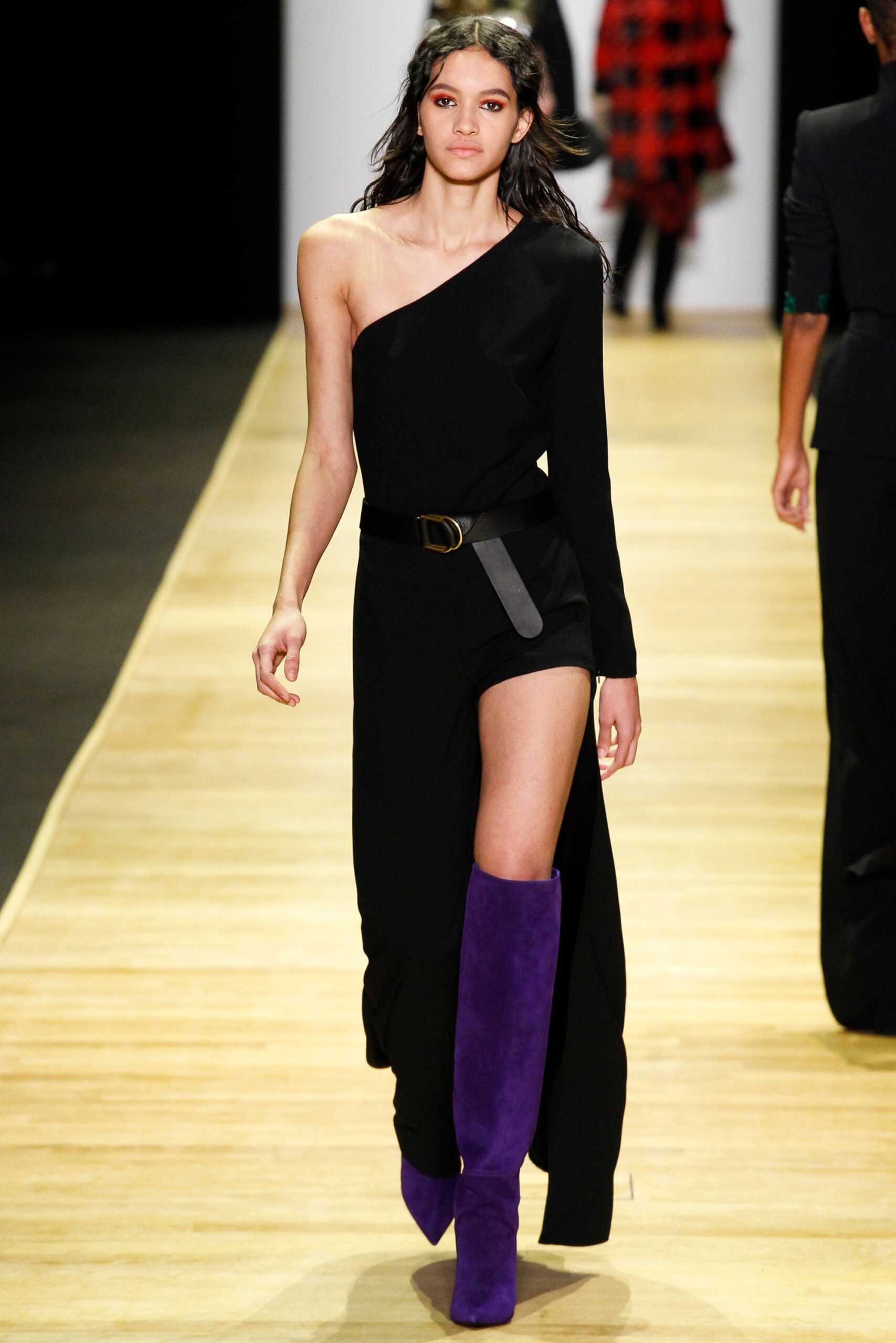 black asymmetric dress with purple boots