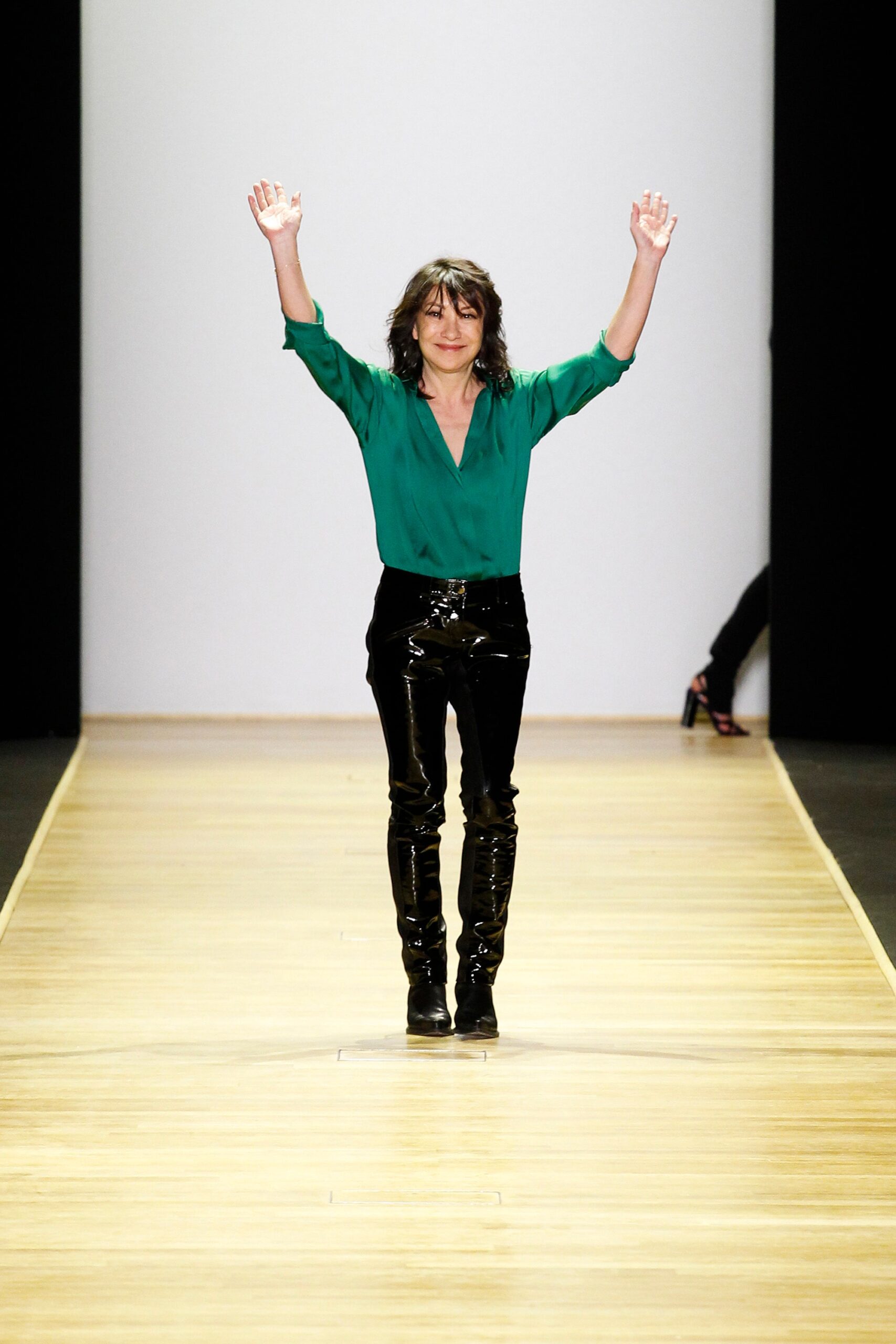 green silk shirt and black vinyl pants