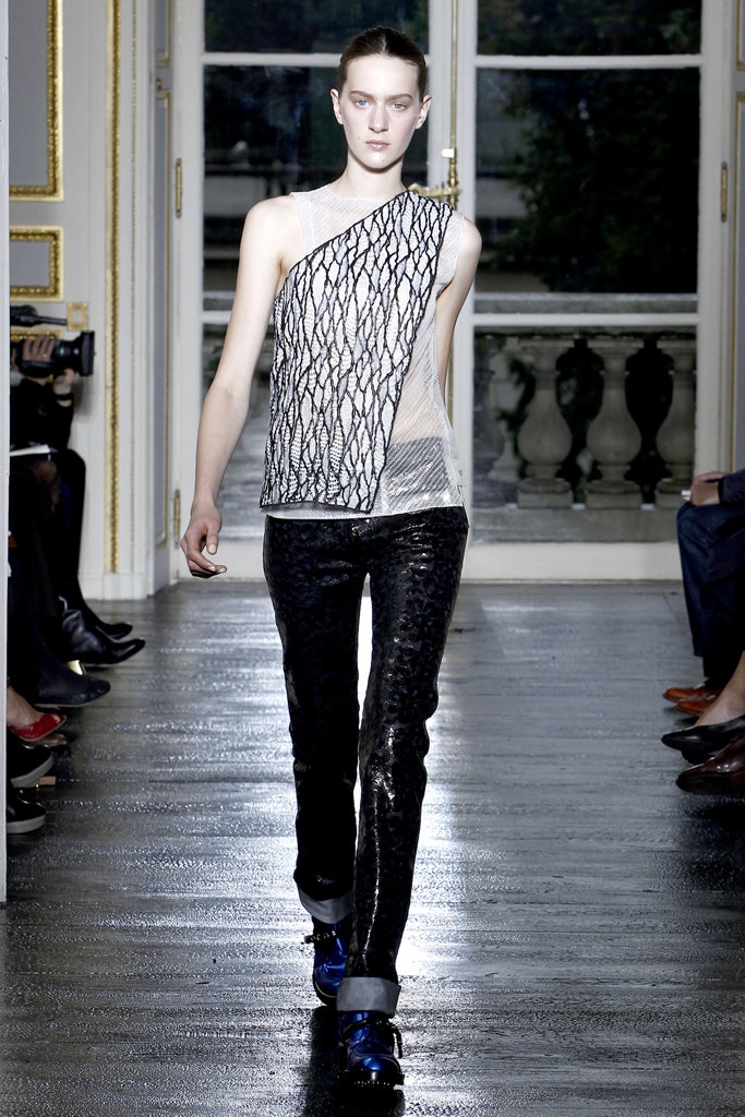 asymmetric black and white top with fitted pants