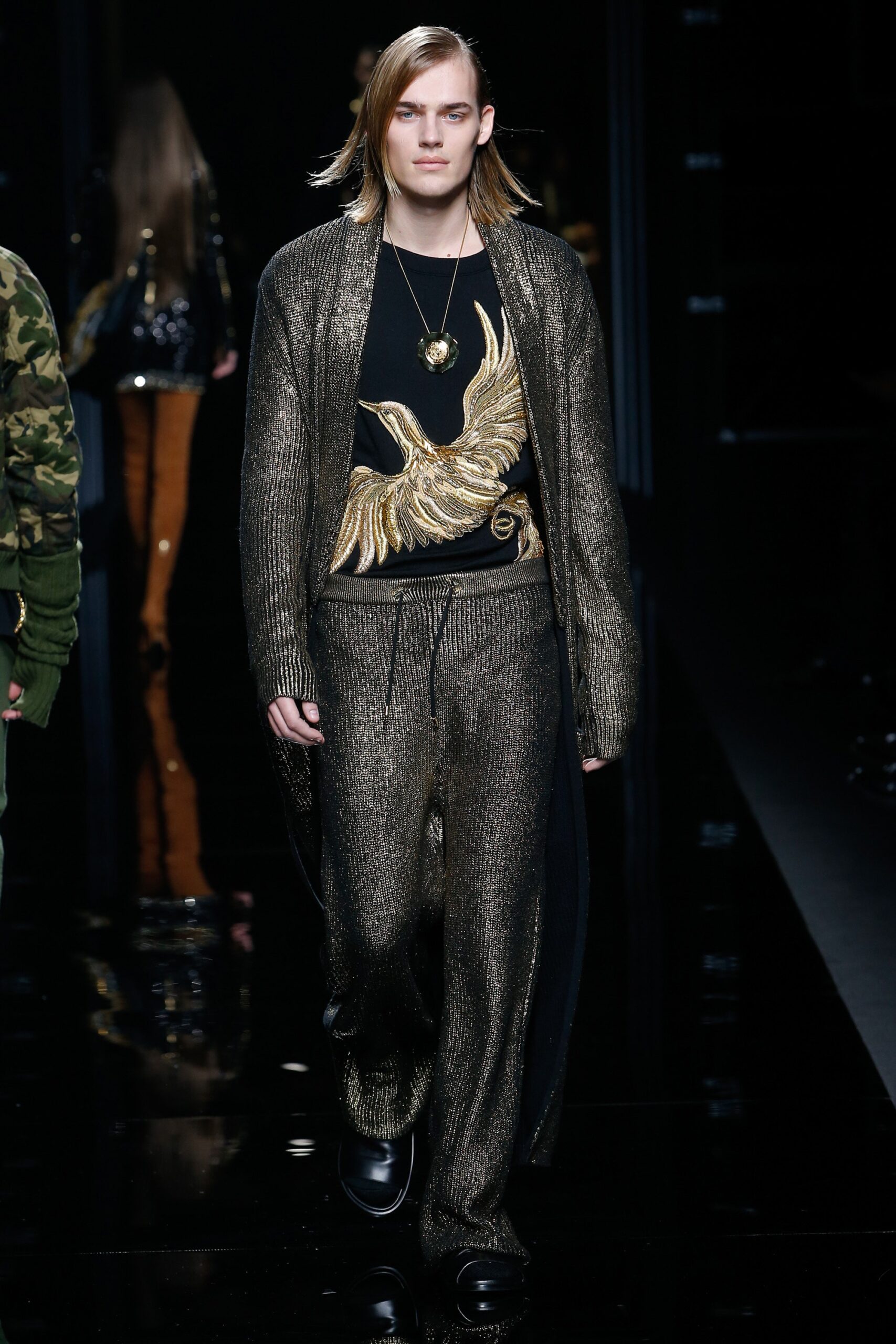 gold knit cardigan with black top