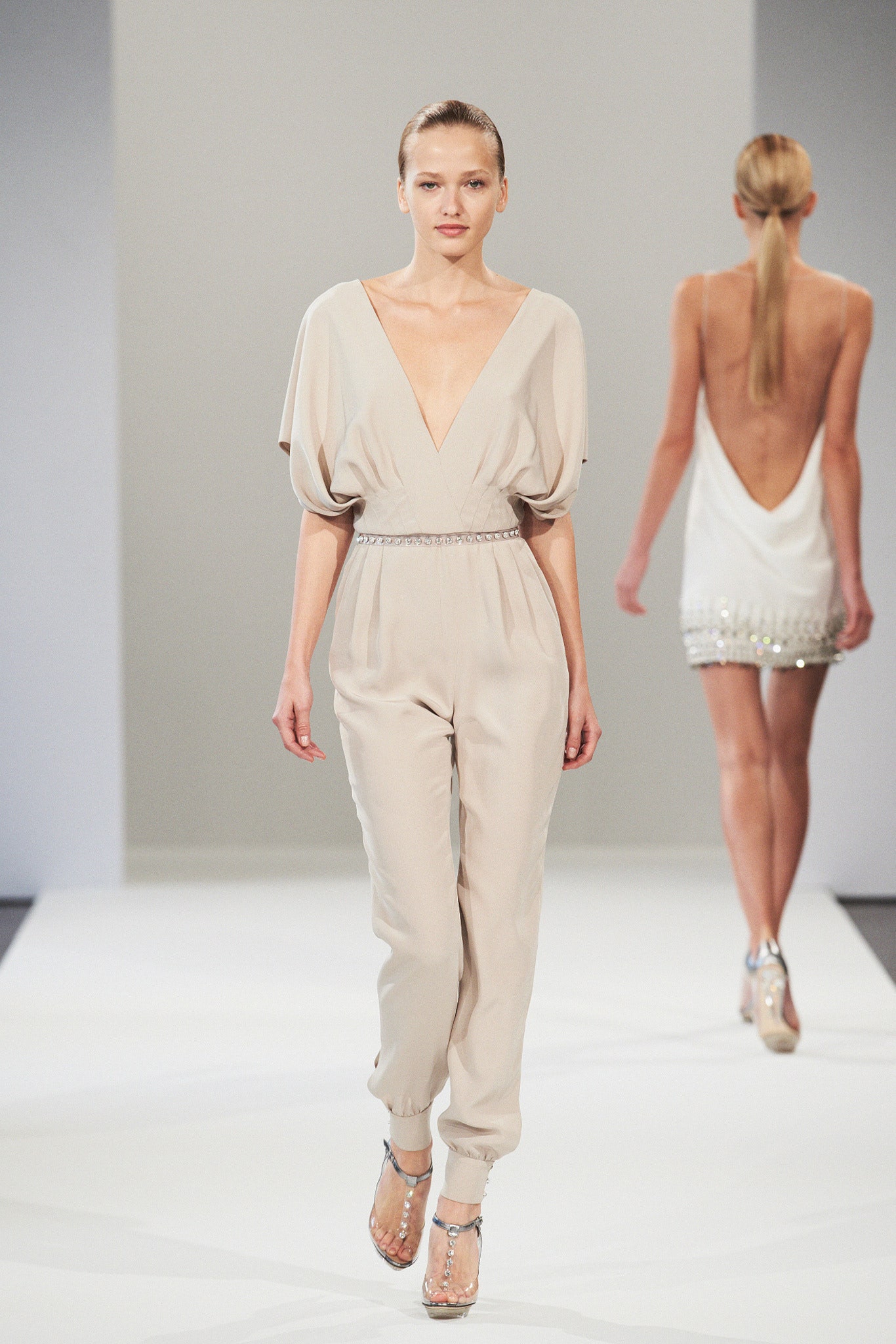 beige silk relaxed jumpsuit and white embellished dress