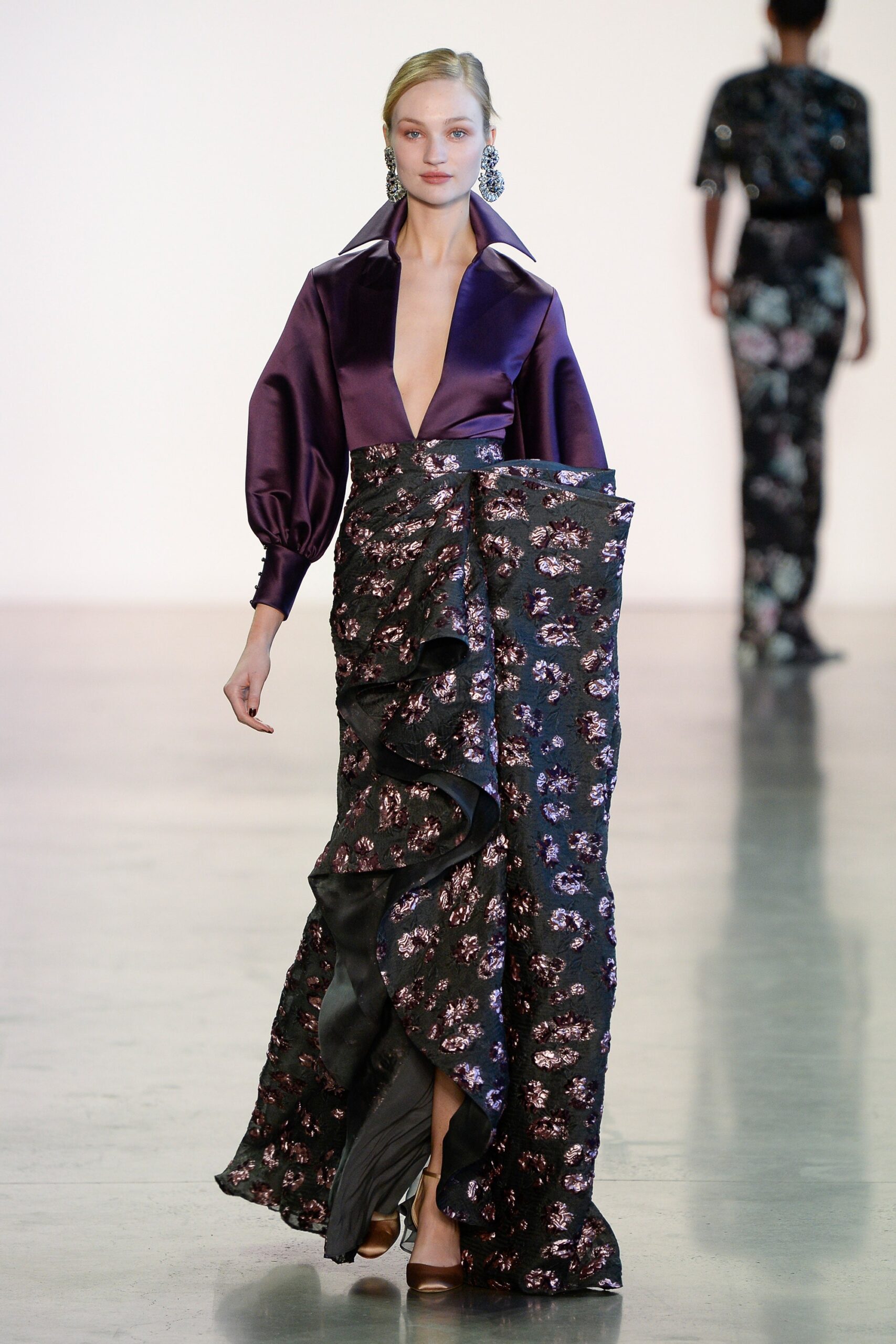 purple silk blouse and black skirt