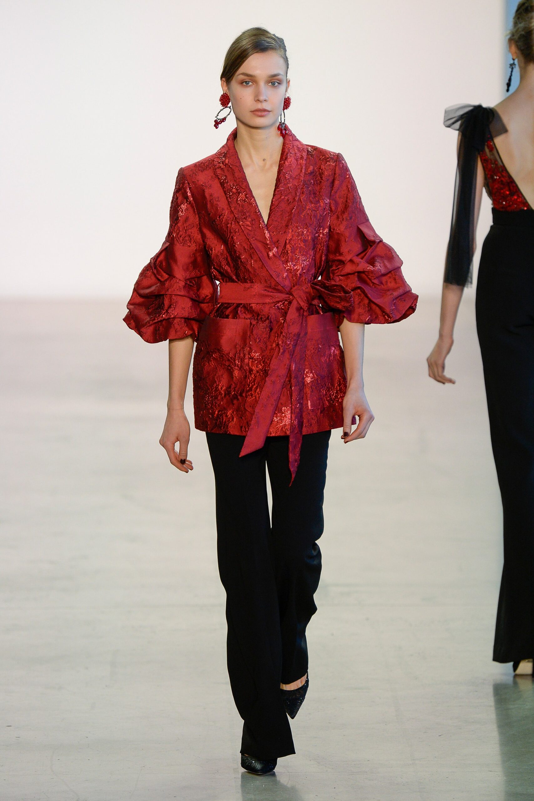 red silk fitted blazer with black tailored pants