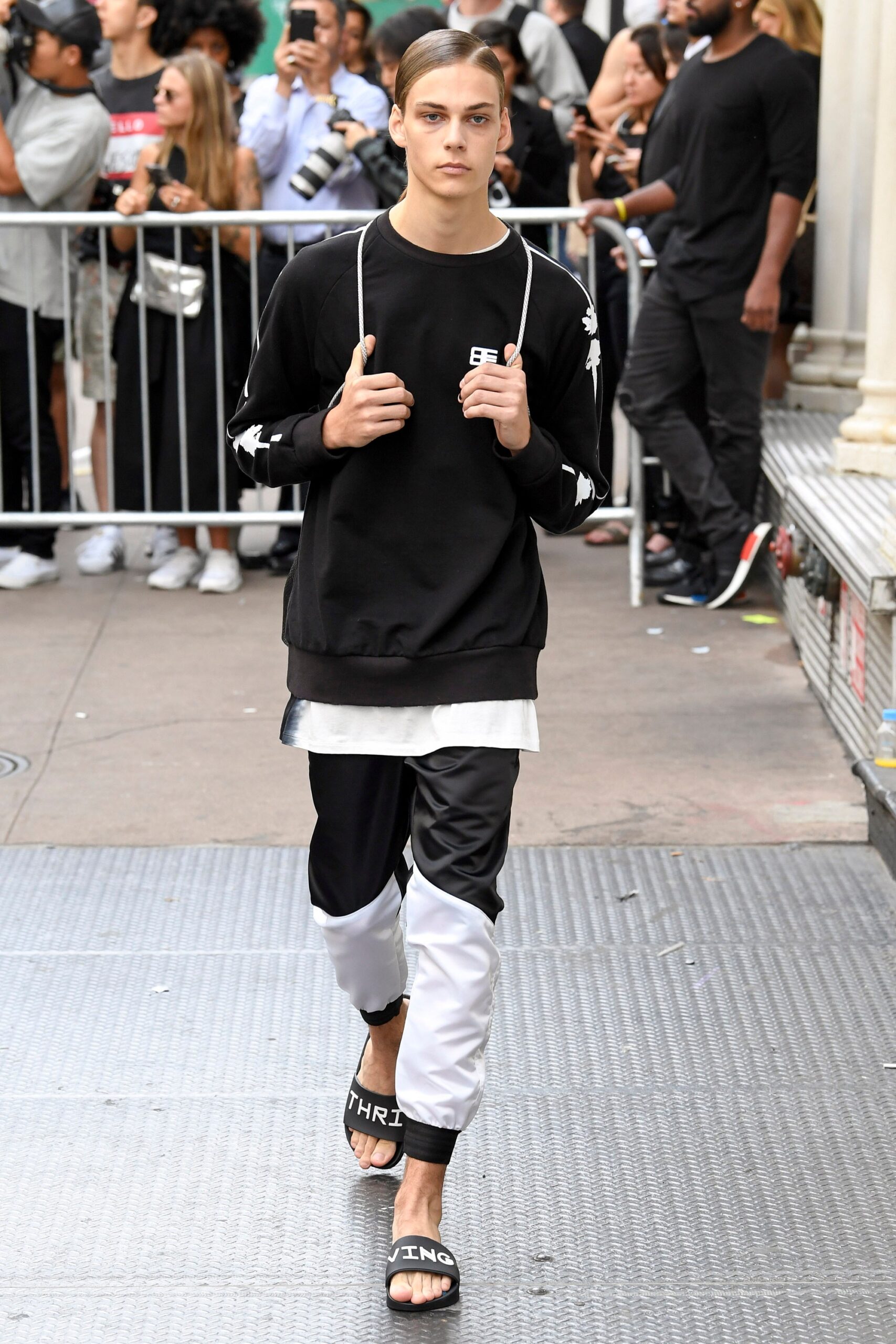 black relaxed sweater with color-blocked pants