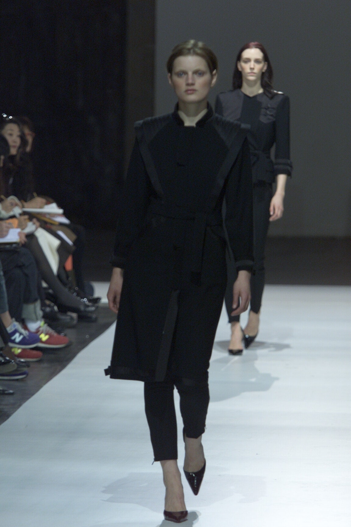 black fitted coat with slim pants