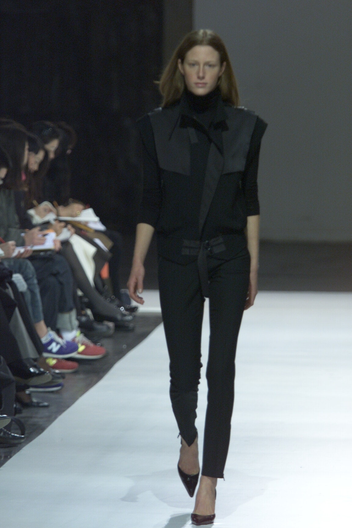 black fitted top and slim pants