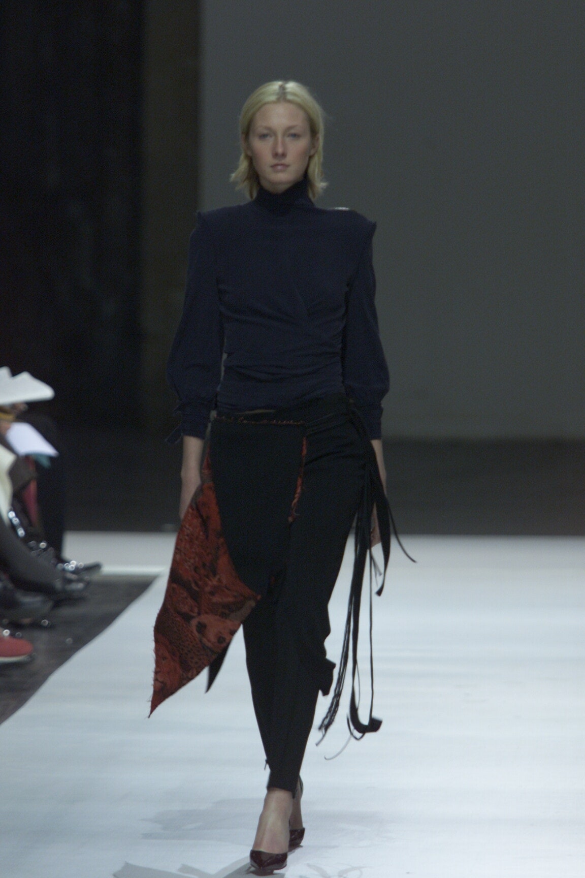 black fitted top with red scarf