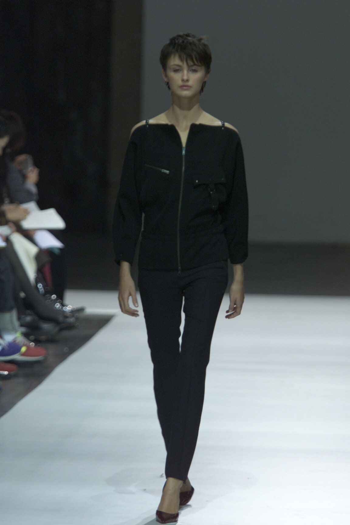 black fitted top and slim pants