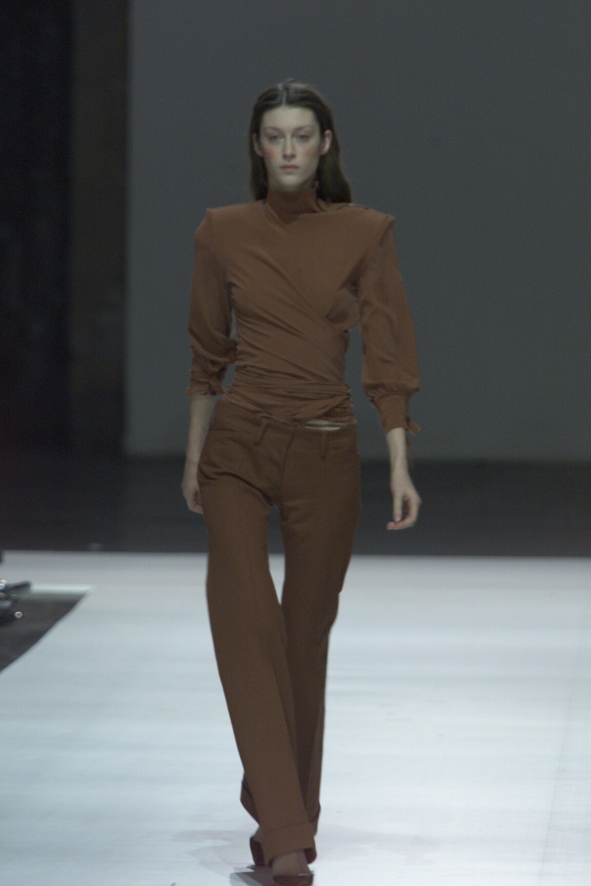 brown fitted top and tailored pants