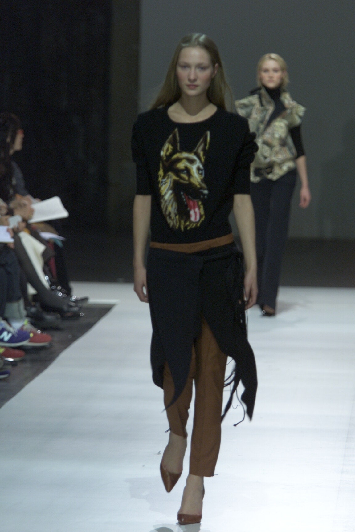 black embroidered top with brown pants