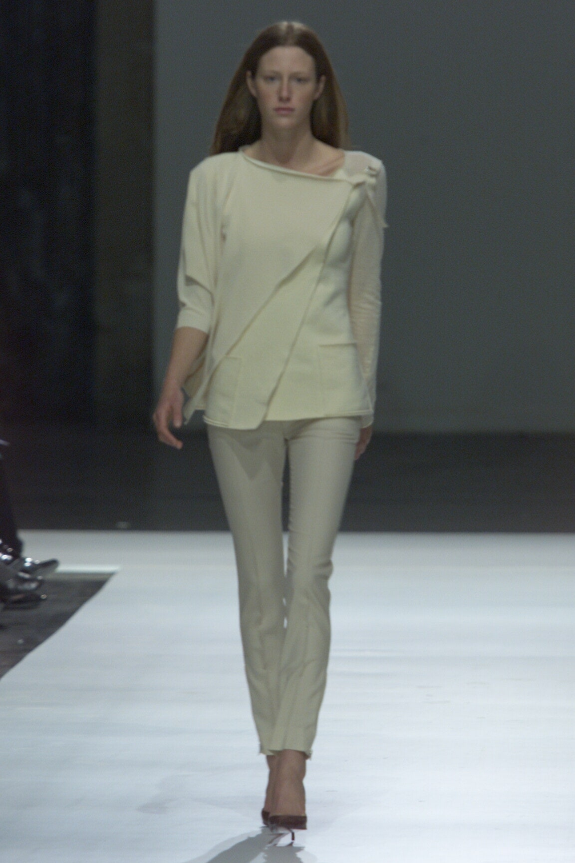 white fitted top with beige pants