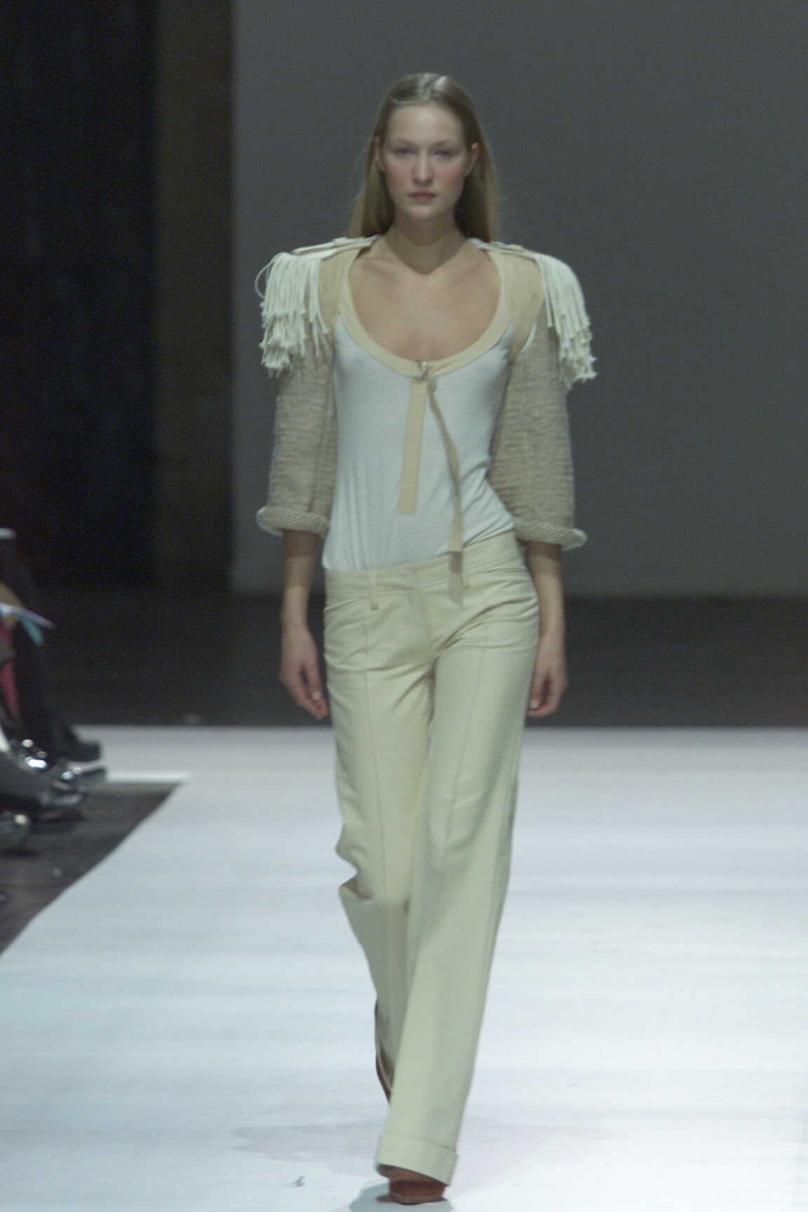 white fitted top and beige tailored pants