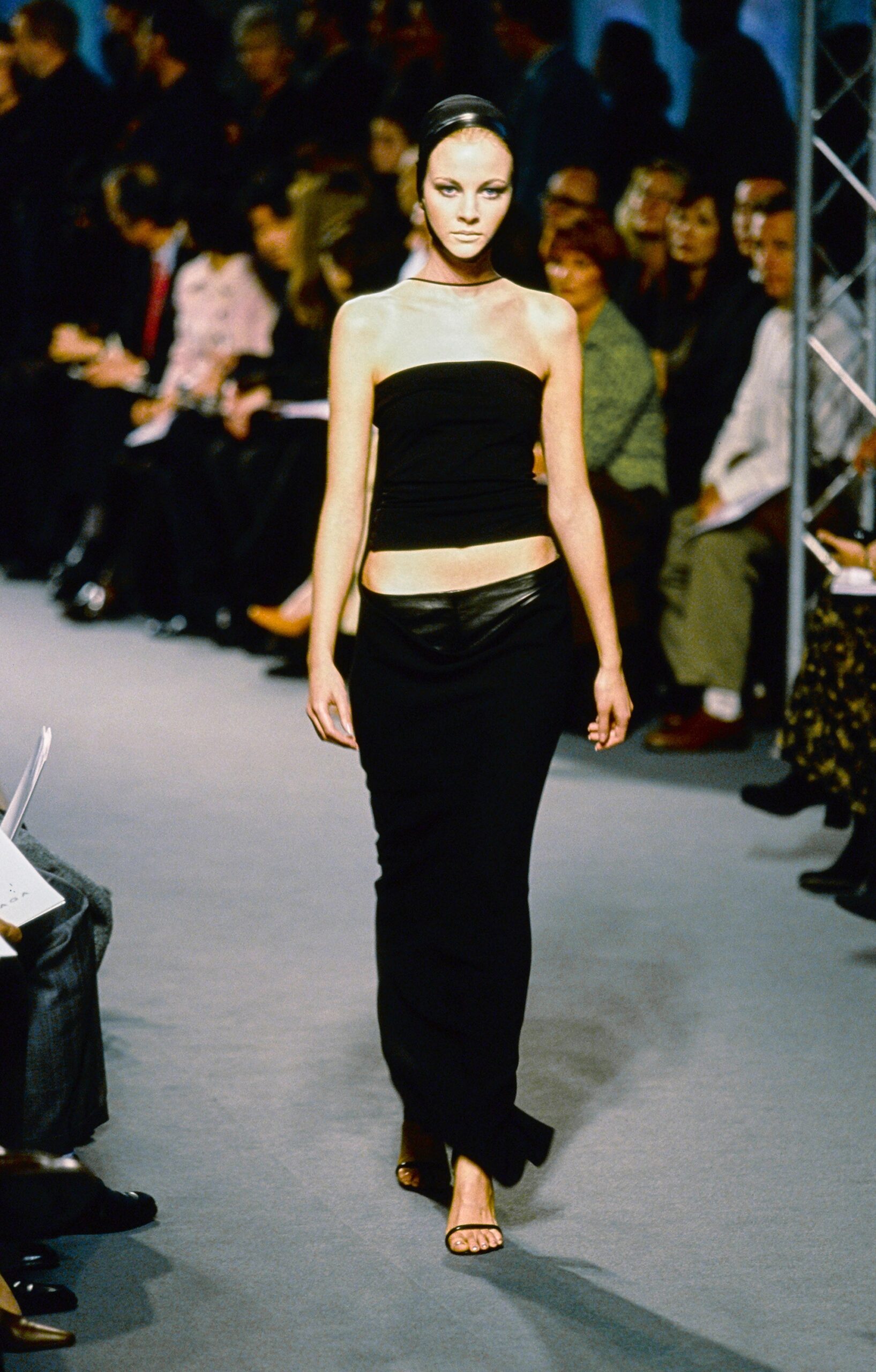 black fitted top and leather skirt