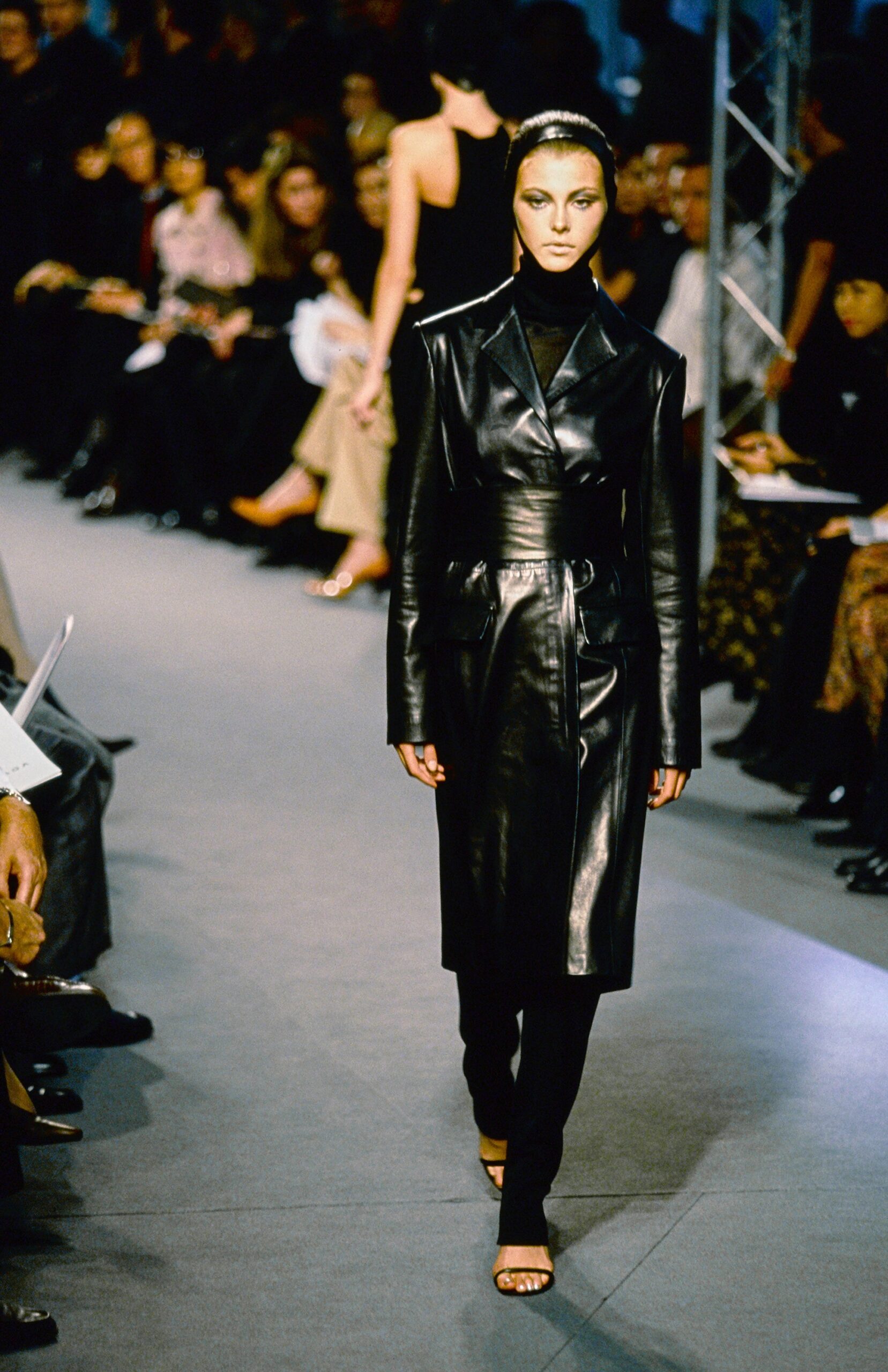 black leather long-sleeve collared fitted belted coat