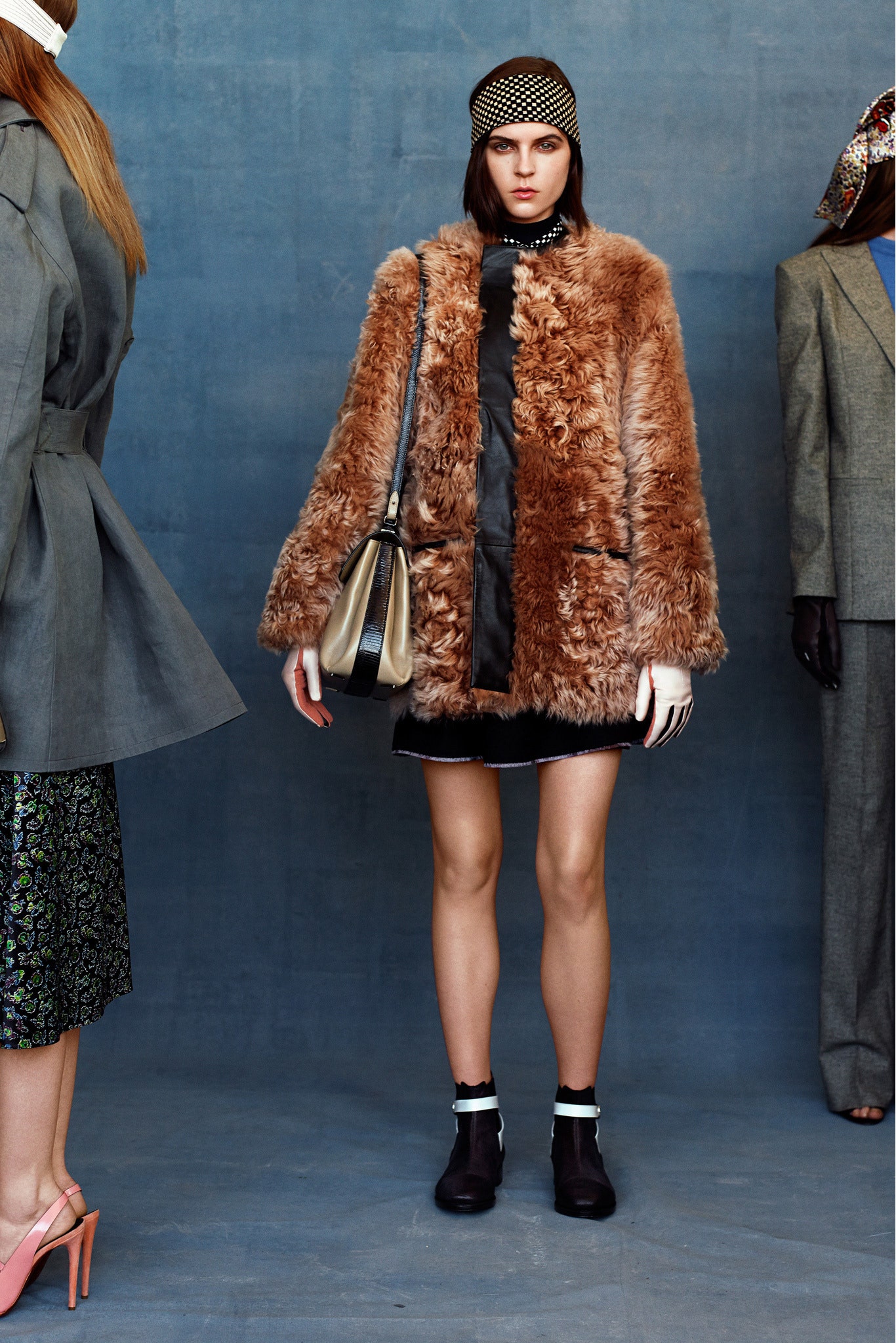 brown faux-fur coat with black dress
