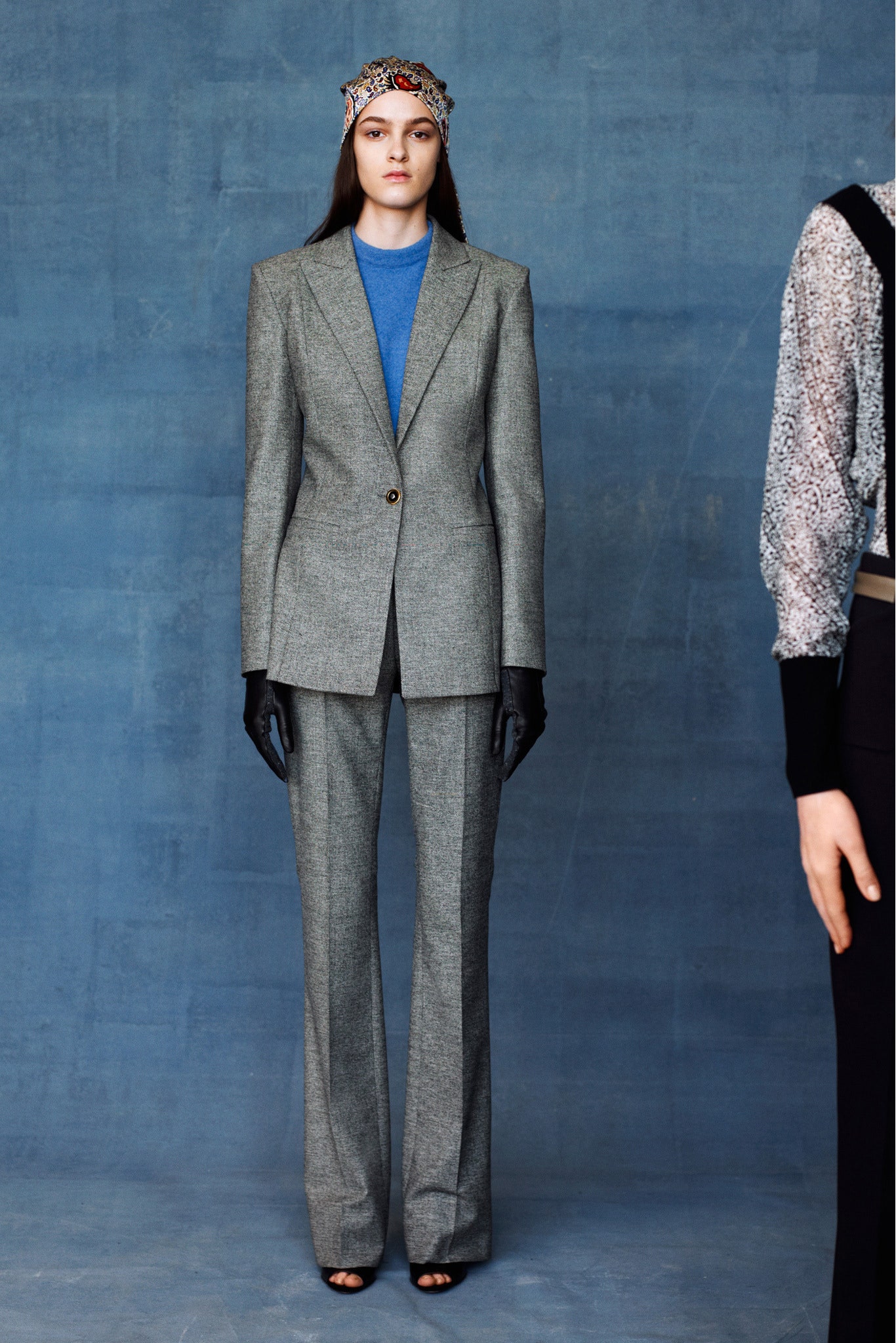 gray tailored suit with blue top