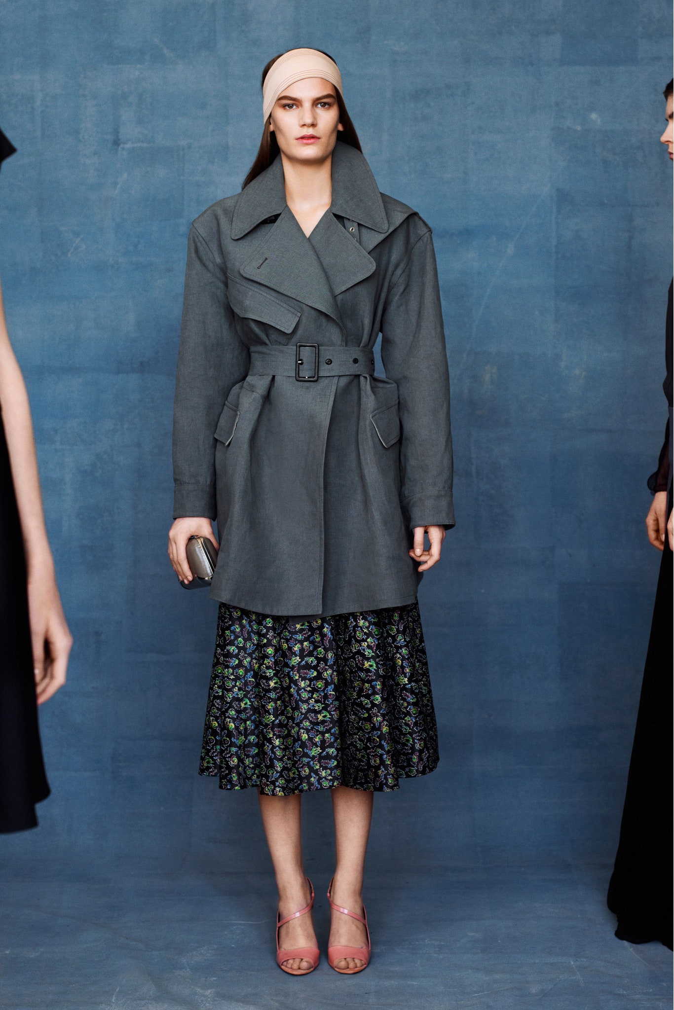 gray tailored coat and black flared skirt