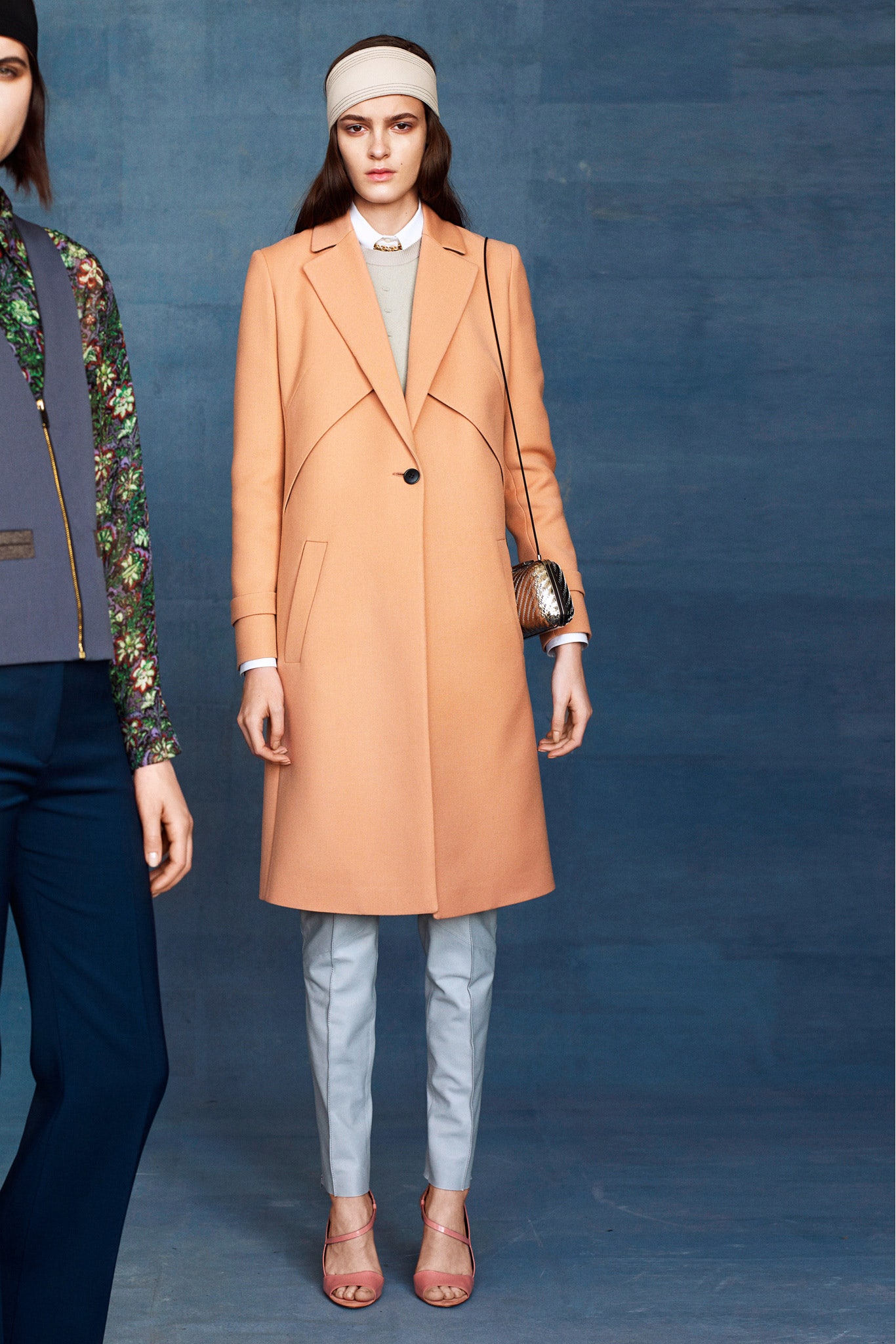 peach tailored coat with light blue pants