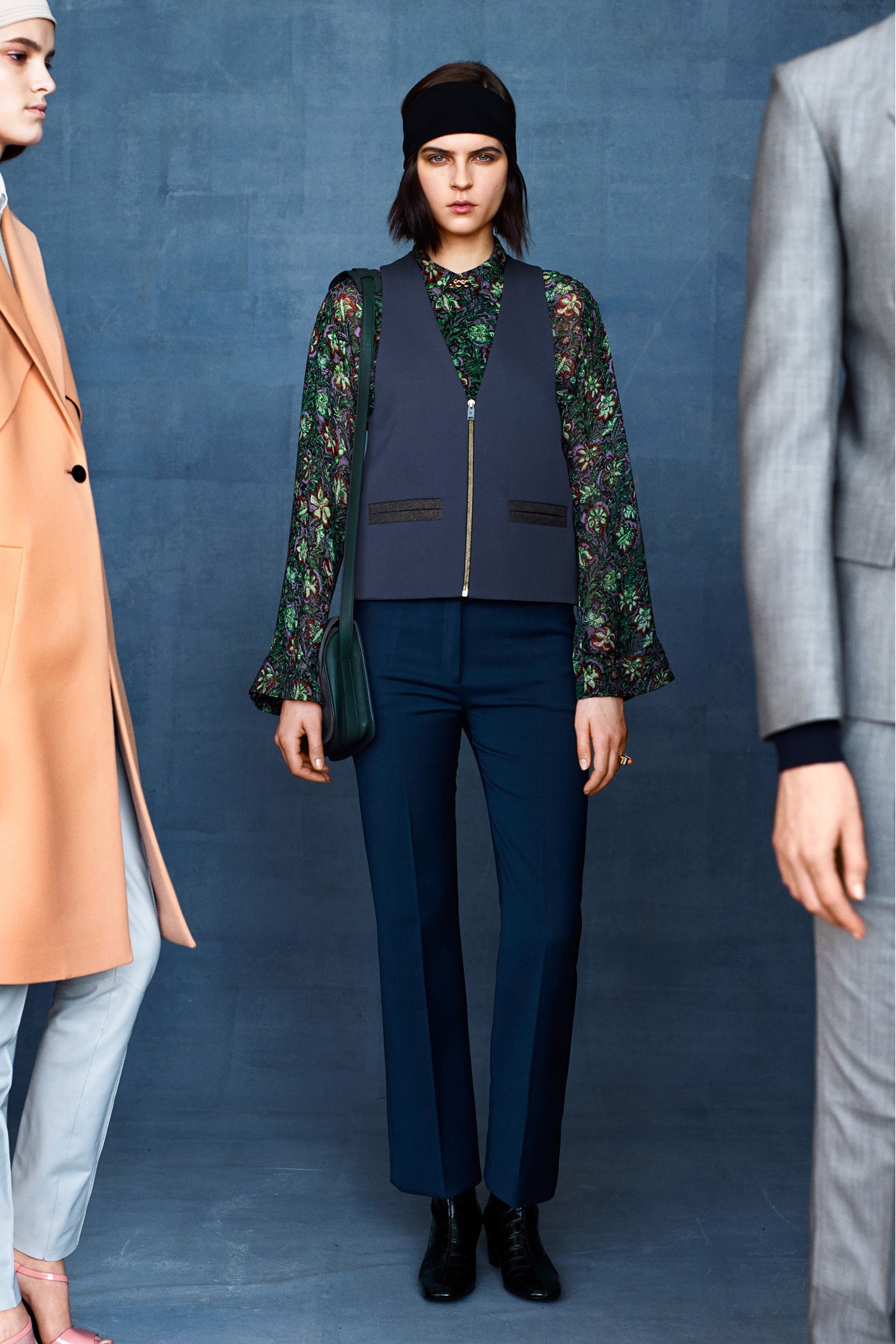 black floral blouse with gray vest