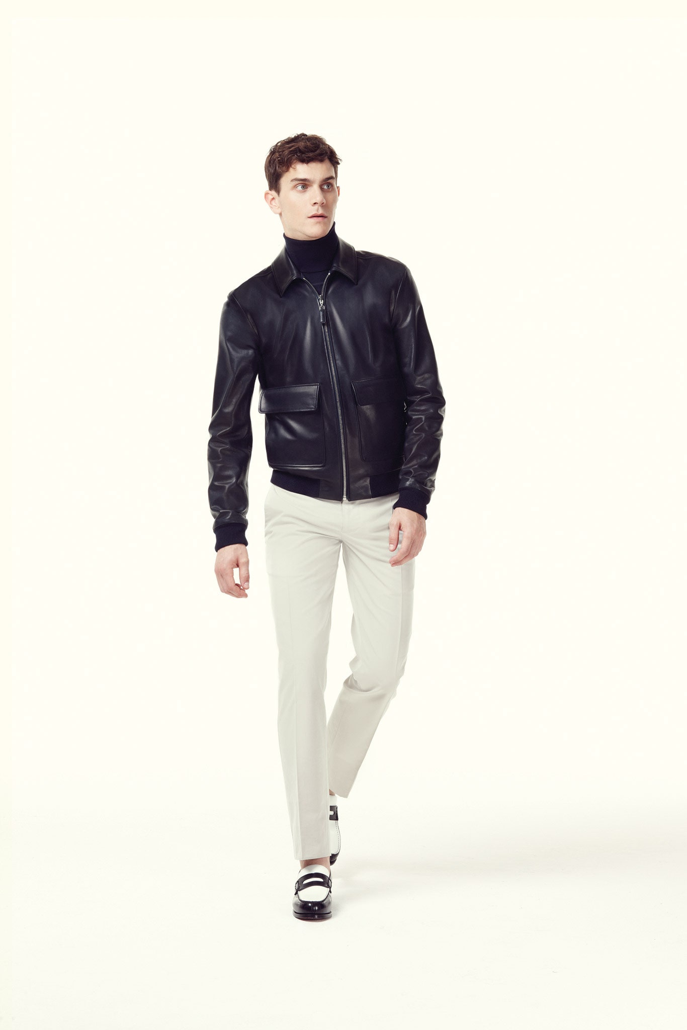 black leather fitted jacket and white pants