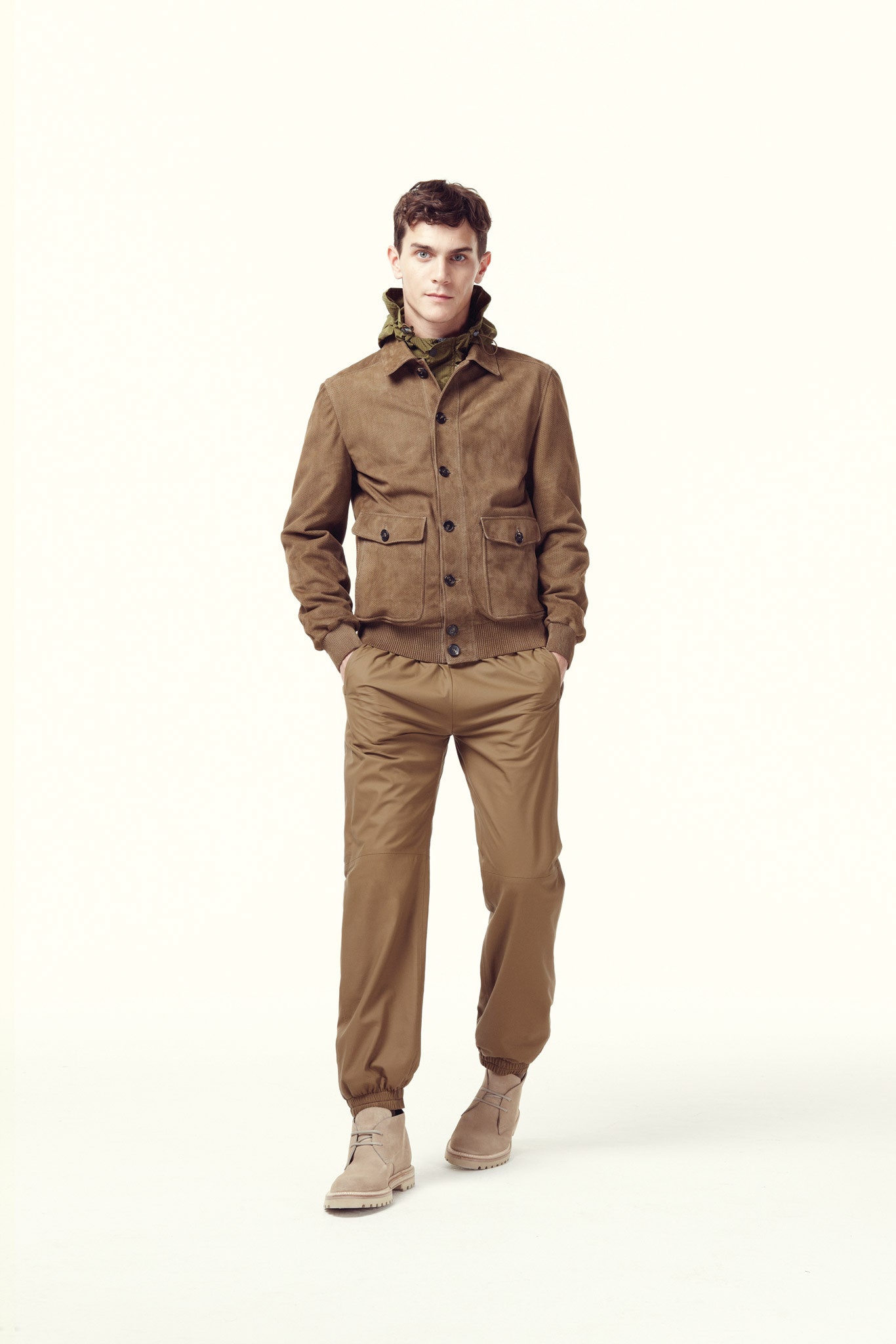 brown suede jacket and beige pants