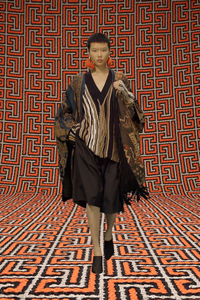 black silk sleeveless dress with multi cape